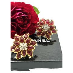 Vintage CHANEL clip-on earring, features a red 'pate de verre' Camelia Blossom