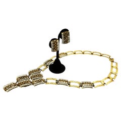 Miriam-Haskell-Set, lange Halskette und Ohrclips, vergoldet, 1950er Jahre, USA