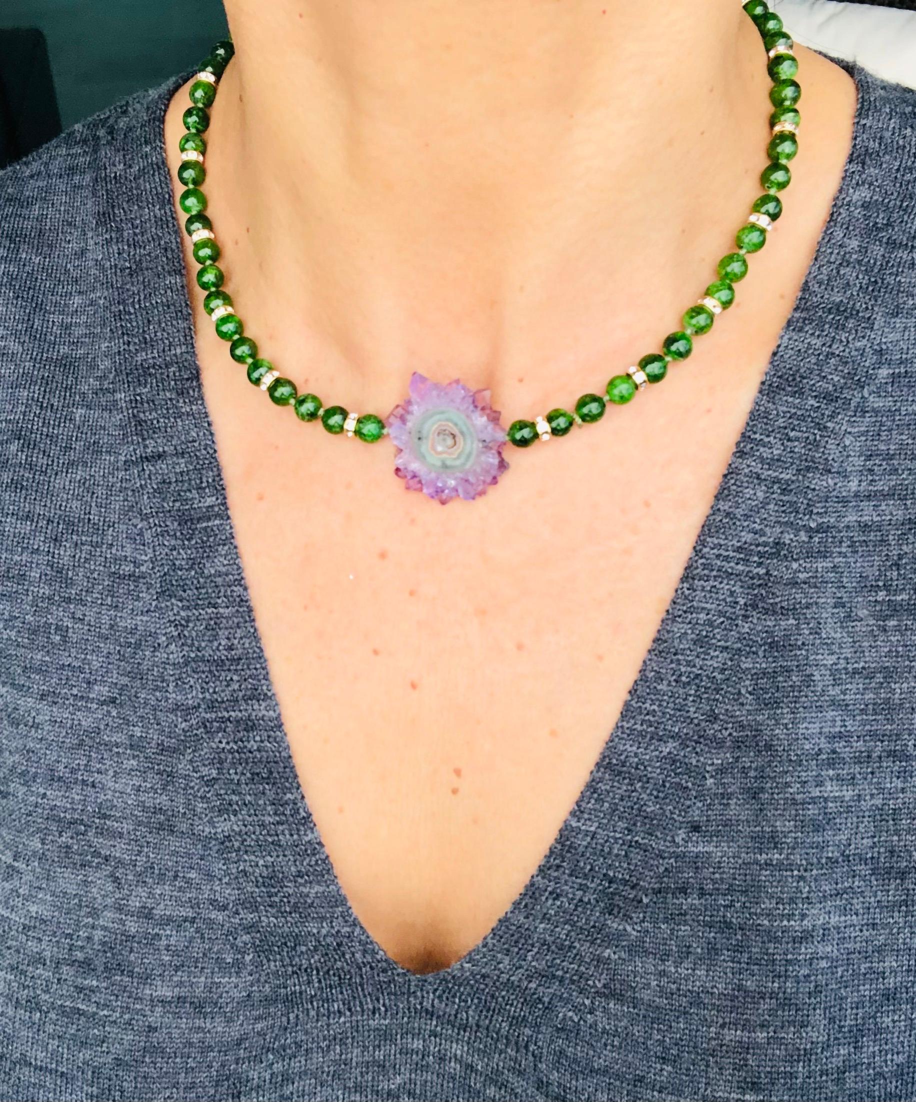 One-of-a-Kind
If you're looking for a statement piece that combines exotic beauty with natural wonder, look no further than this stunning necklace featuring Chrome Diopside polished beads and an Amethyst Stalactite.
Chrome Diopside is a rare and