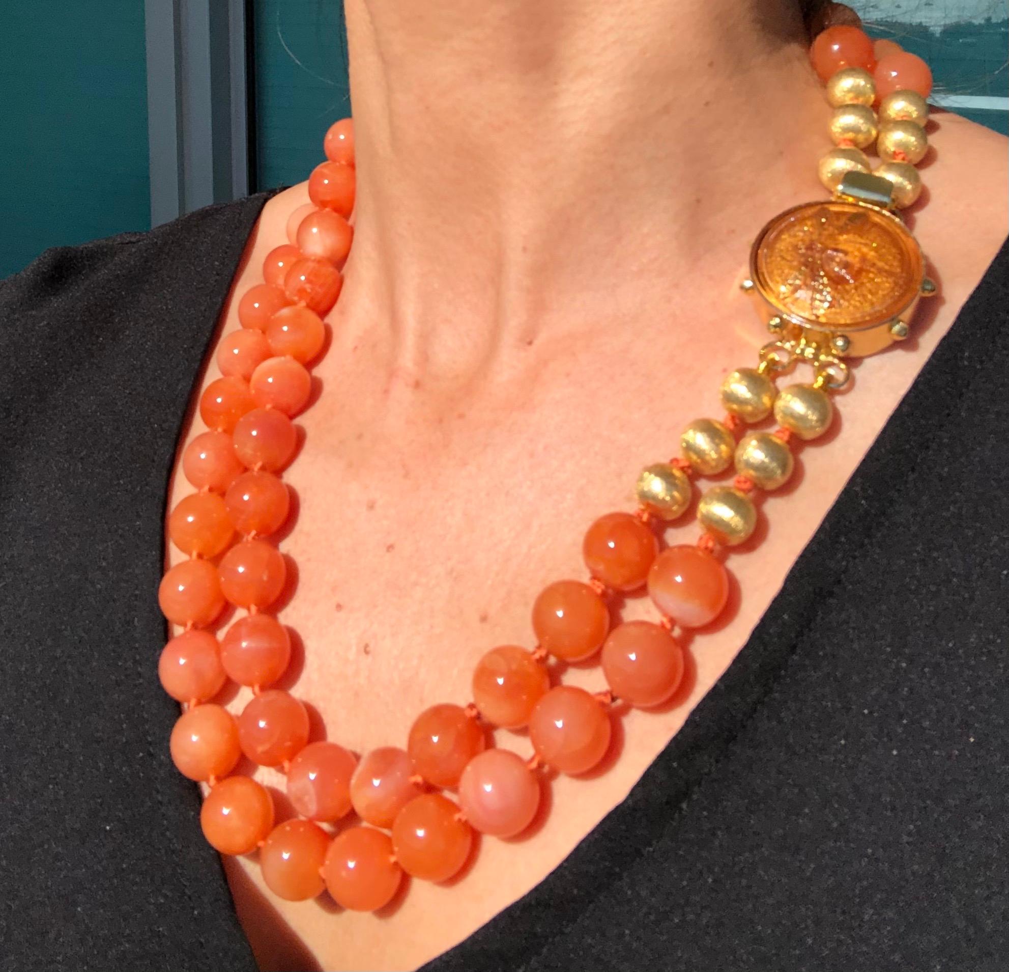 One-of-a-Kind
What a hard to describe color! Is there such a thing as a creamy orange? At any rate, this 14mm double strand matinee length necklace is easy to wear with a rainbow of colors. The clasp is a perfect foil for the beads separated by six