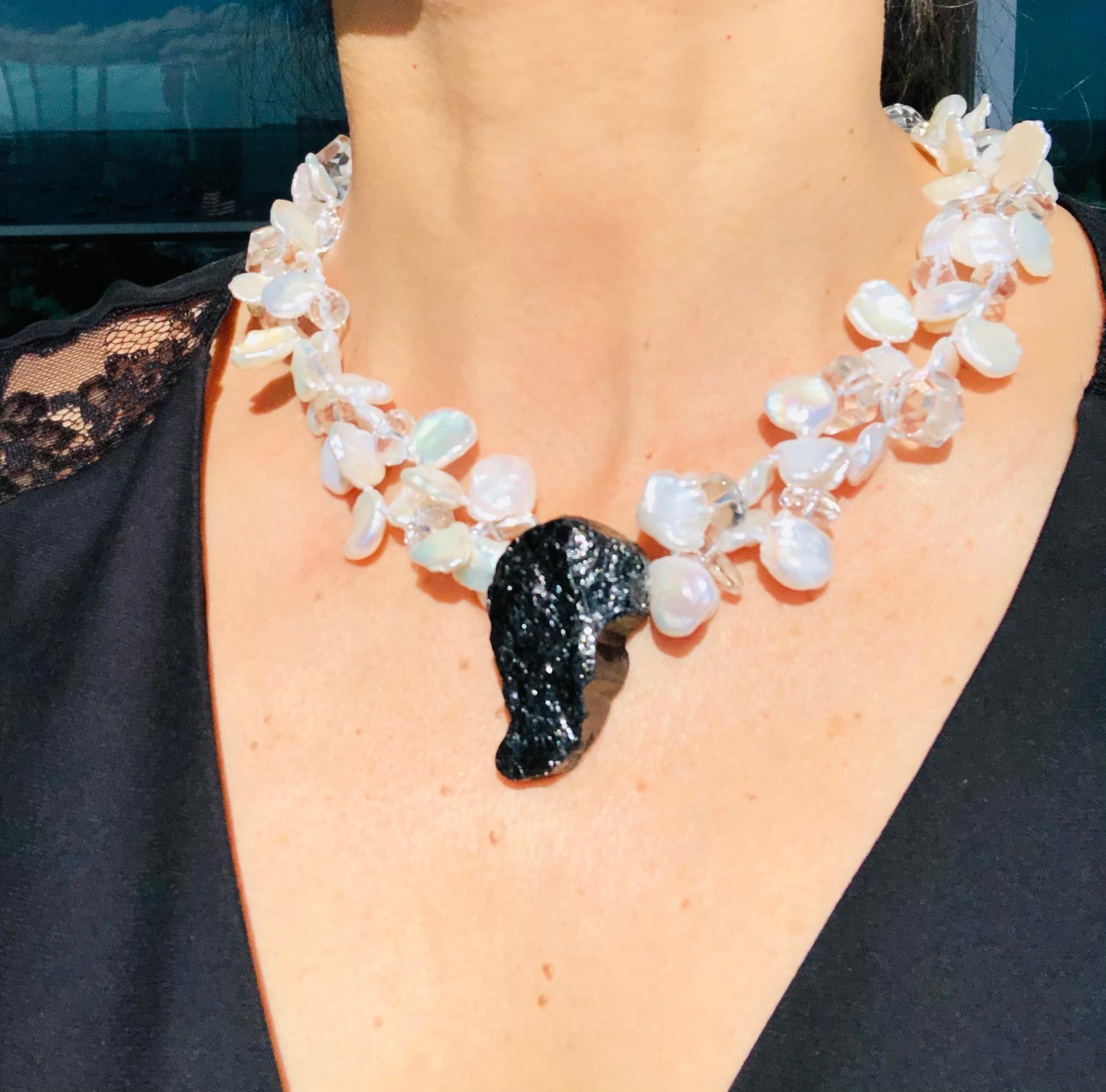 One-of-a-Kind
What is more useful than a black and white goes -with -everything black and white necklace. Particularly when the black is a solid hunk of Tourmaline and the necklace a double strand of matched flat-sided Pearls enhanced with faceted