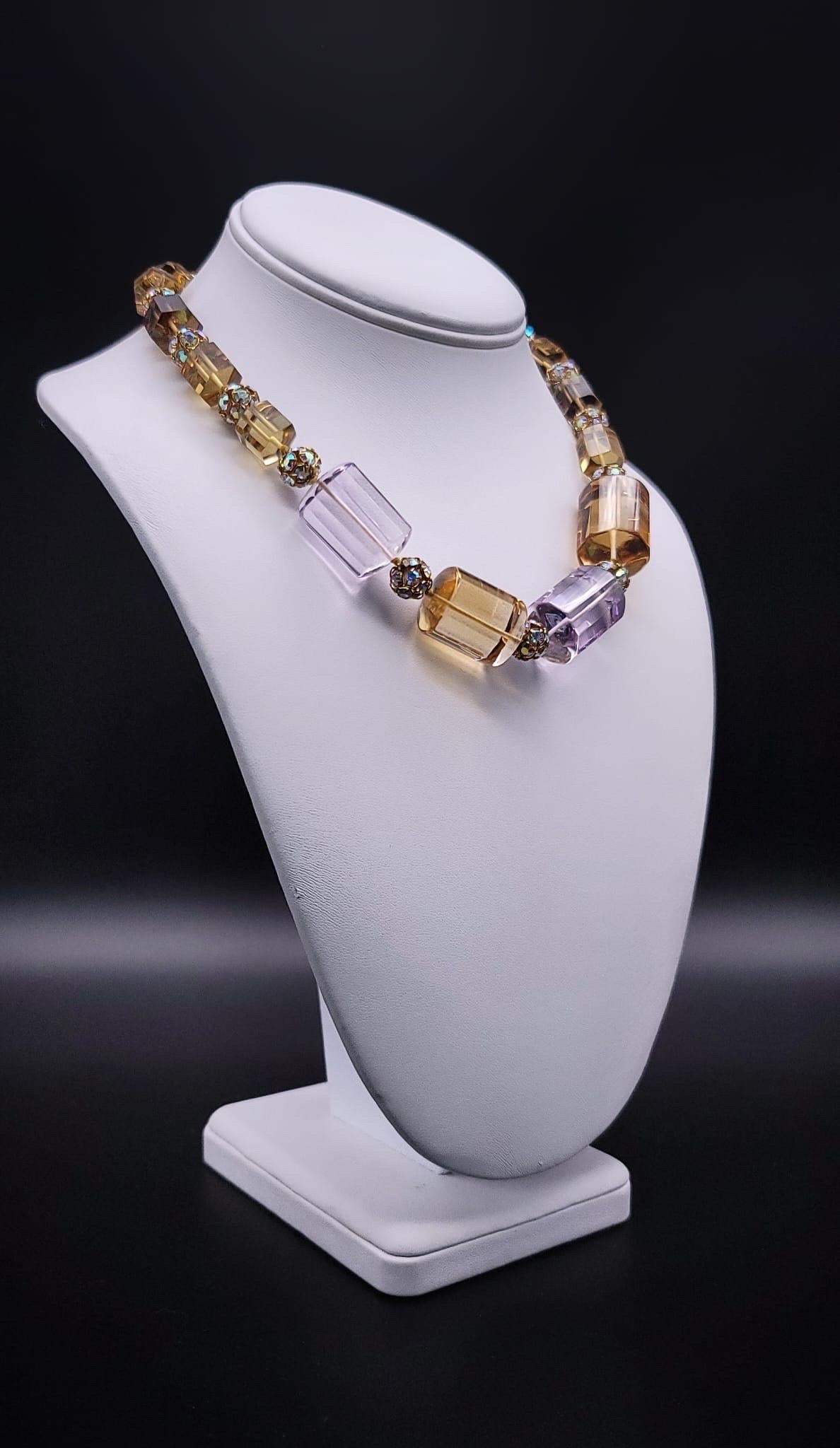 One-of-a-Kind

Precious necklace Purple Amethyst, Topaz Citrine cylindrical, Brazilian cut graduated stones separated by vermeil 22k over sterling silver spacers, held by smoky quartz and vermeil clasp. The Quartz is very clear and presents a soft