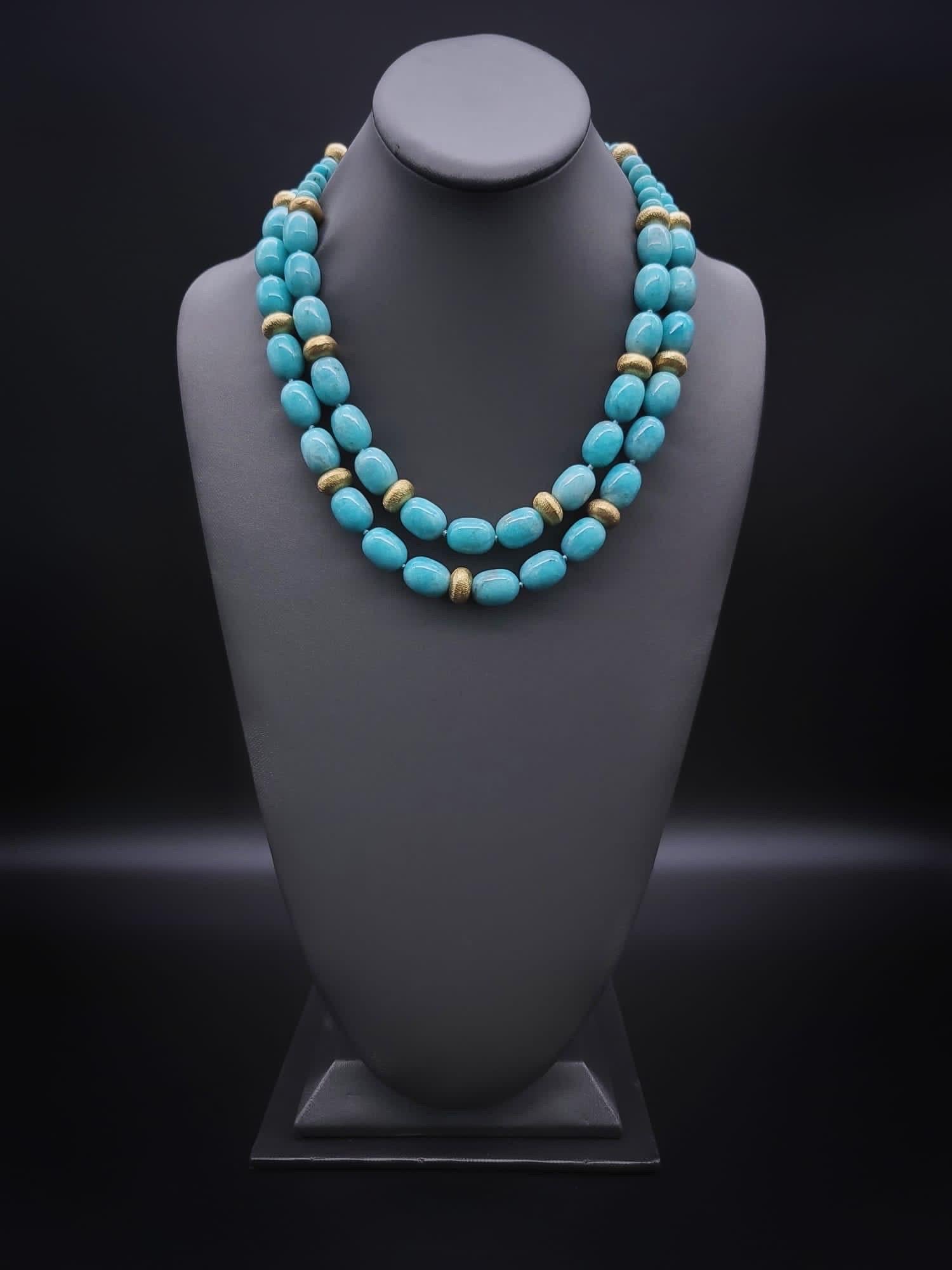 One-of-a-Kind
Polished Amazonite two strands necklace. The necklace is accented with brushed vermeil rondels oval beads in a double strand.
Amazonite, a rich Verdigris (green/ blue) stone known for the depth of its color and named for the Amazon