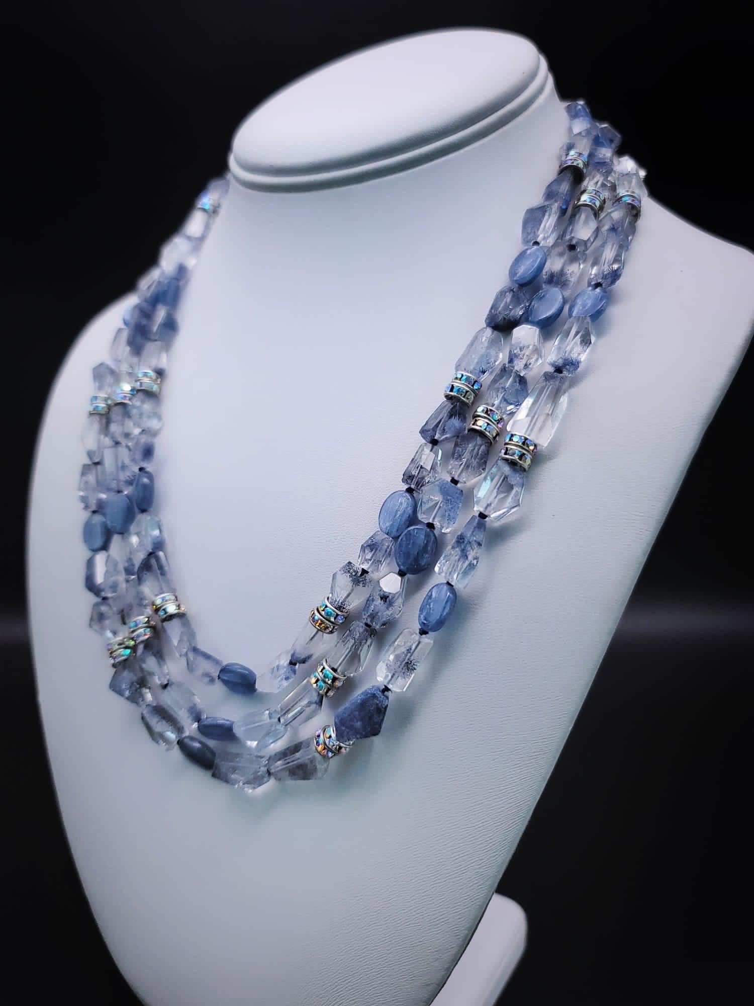 One-of-a-Kind

This exquisite piece of jewelry is a one-of-a-kind matinee-length necklace that exudes a sense of timeless elegance. The necklace features faceted Quartz beads that have been expertly mixed with Kyanite to create a beautiful soft blue
