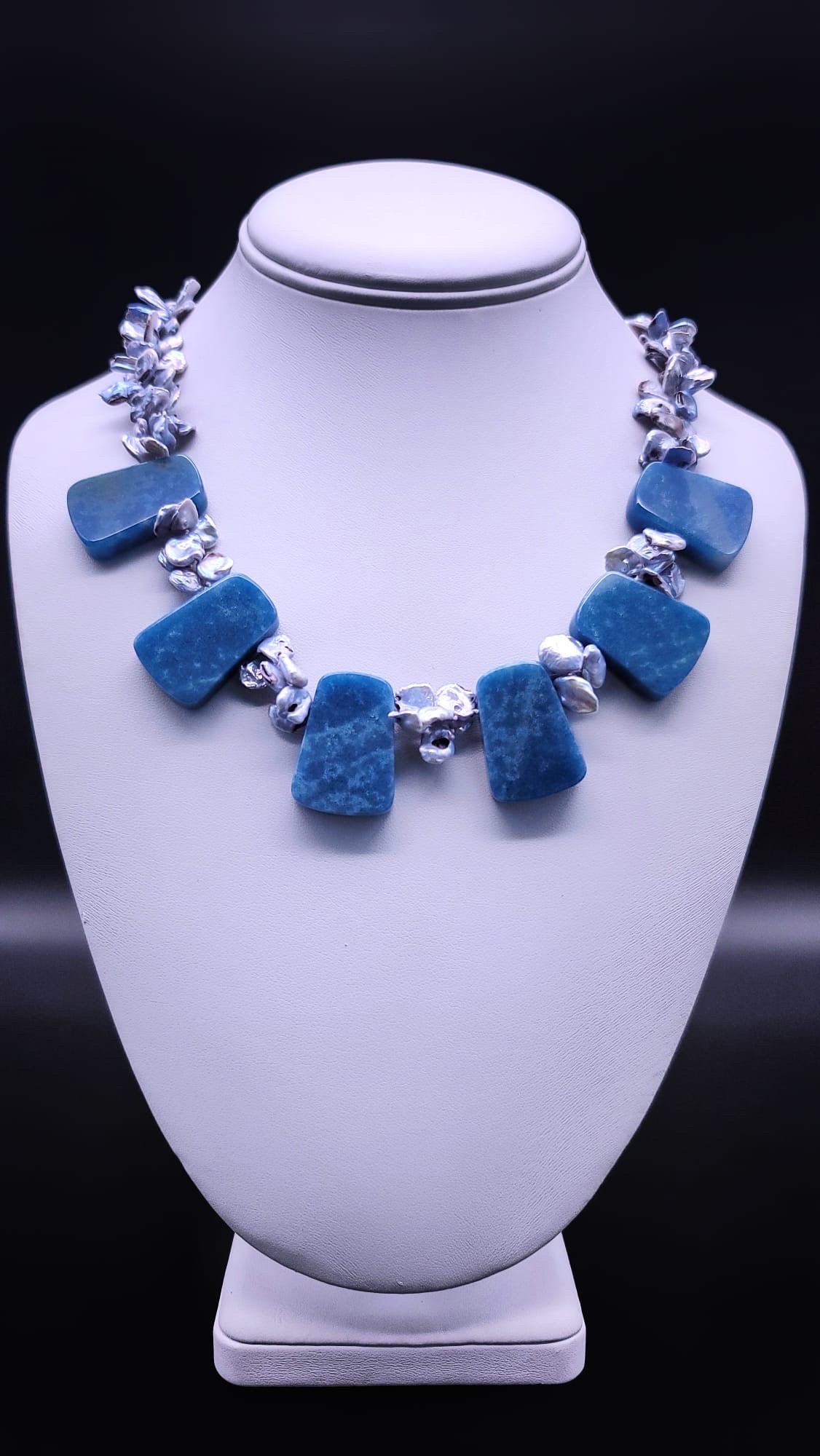 One-of-a-Kind

Indulge in the heavenly beauty of this stunning blue quartz necklace mixed with blue baroque pearls. Each stone complements the other, creating a unique and interesting mix that is sure to turn heads.
The highly polished blue quartz