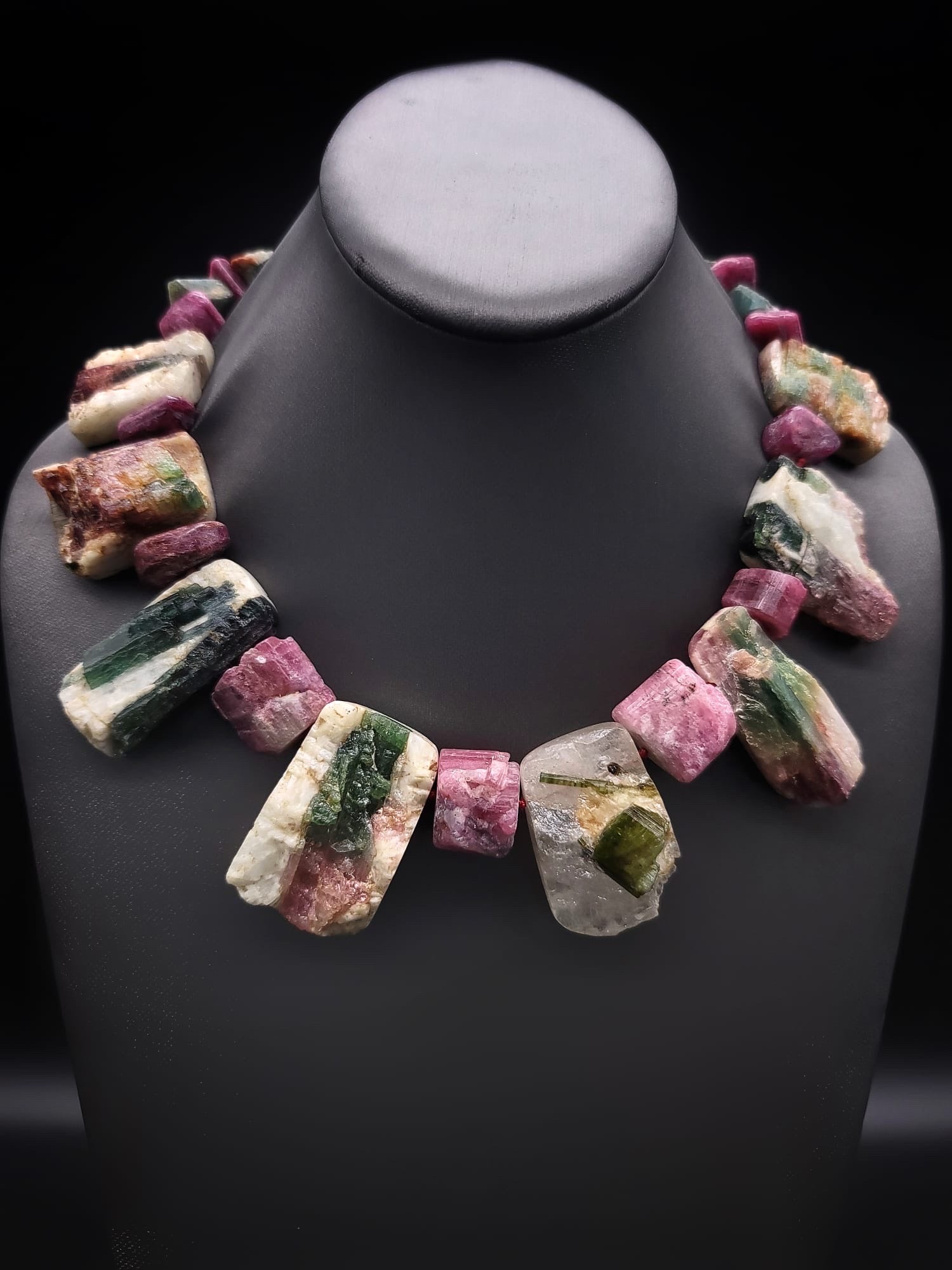 
Prepare to be enchanted by the breathtaking beauty of our one-of-a-kind Watermelon Tourmaline necklace. This spectacular piece features a mesmerizing collection of mixed-colored natural Watermelon Tourmaline stones, each carefully matched within