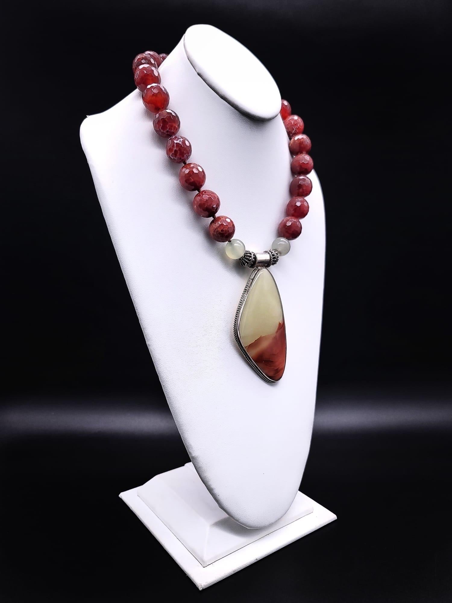 One-of-a-Kind
Show-stopping pale green onyx shaded to deep rust, mimicking a mountain range pendant. The pendant is suspended from equally interesting faceted Mexican fire beads. The fittings are sterling silver.
The clasp mounted in sterling silver