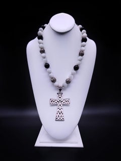 A.Jeschel Large Sterling Silver Cross hangs from a Moonstone and Onyx Necklace