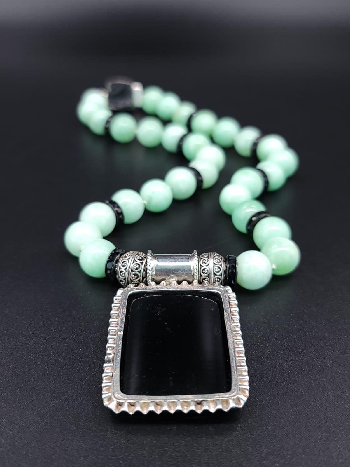 Women's or Men's A.Jeschel Green Moonstone necklace with Erte Art Deco pendant . For Sale