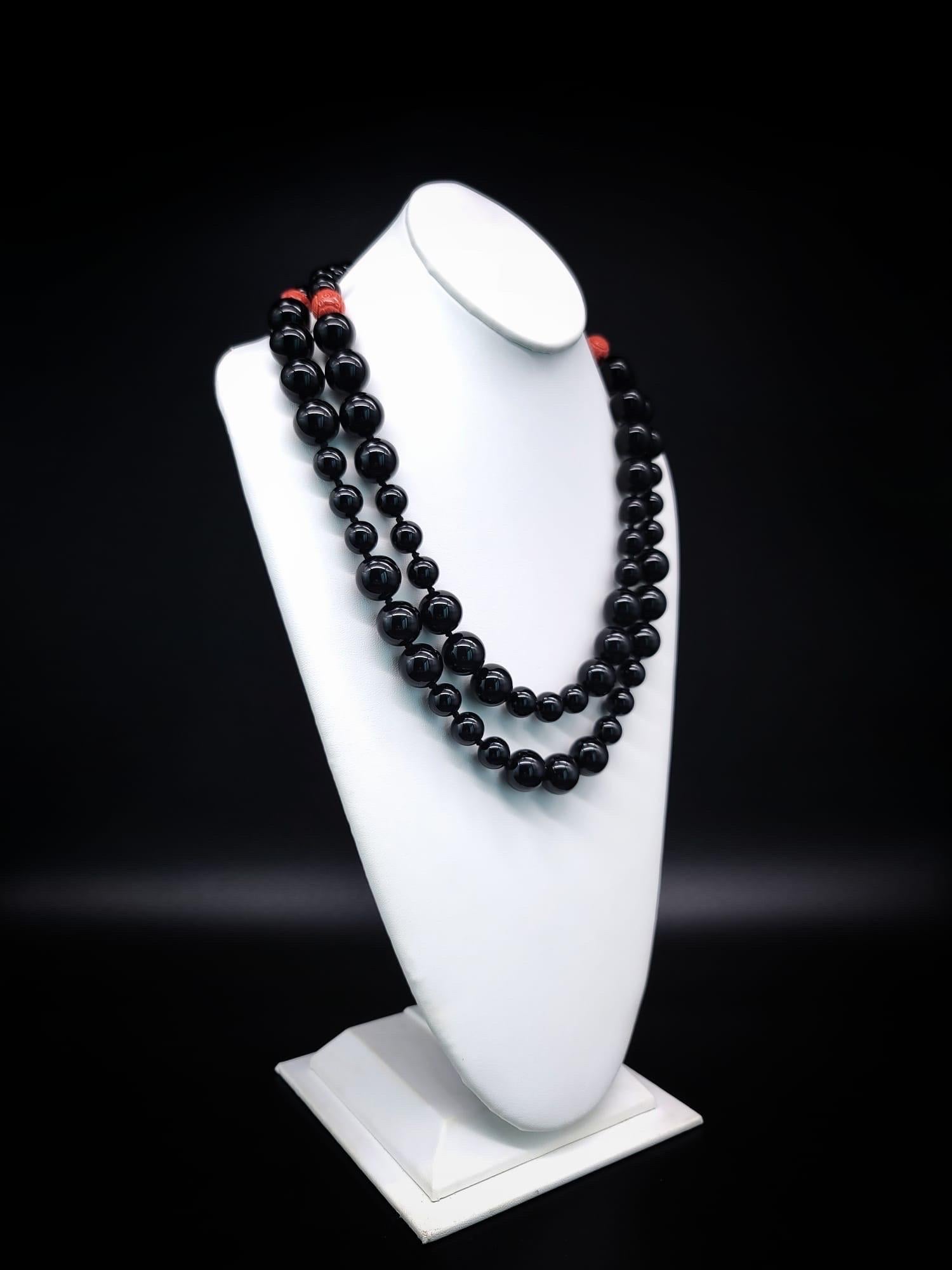 Mixed Cut A.Jeschel Stunning Onyx necklace with carved Cinnabar clasp.