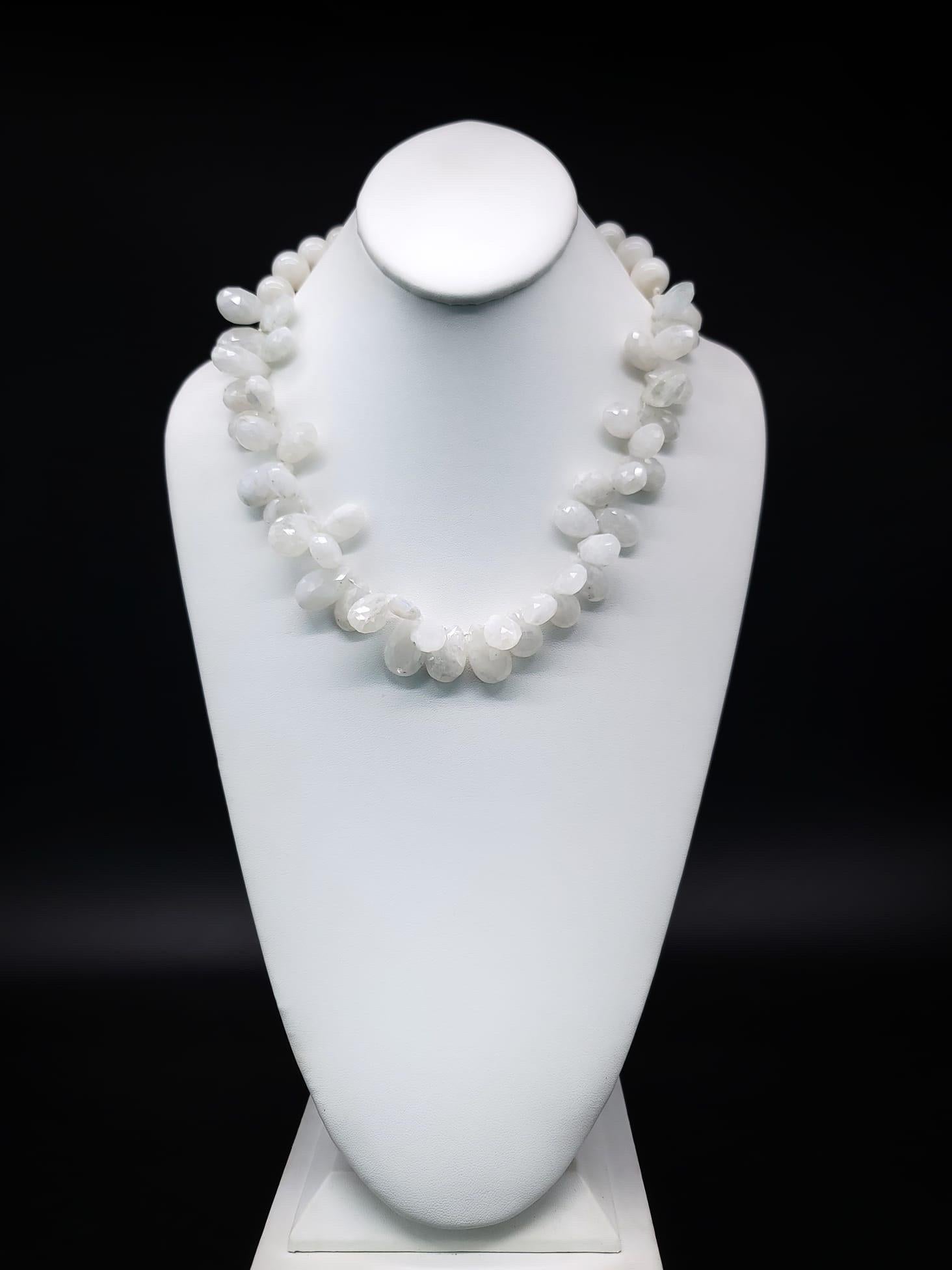 One-of-a-Kind

This exquisite necklace features a stunning ruffled Bibb of white moonstone, delicately surrounding the neck. The faceted tear-drop stones reflect the light beautifully, reminding us of how the stone got its name. Supporting this