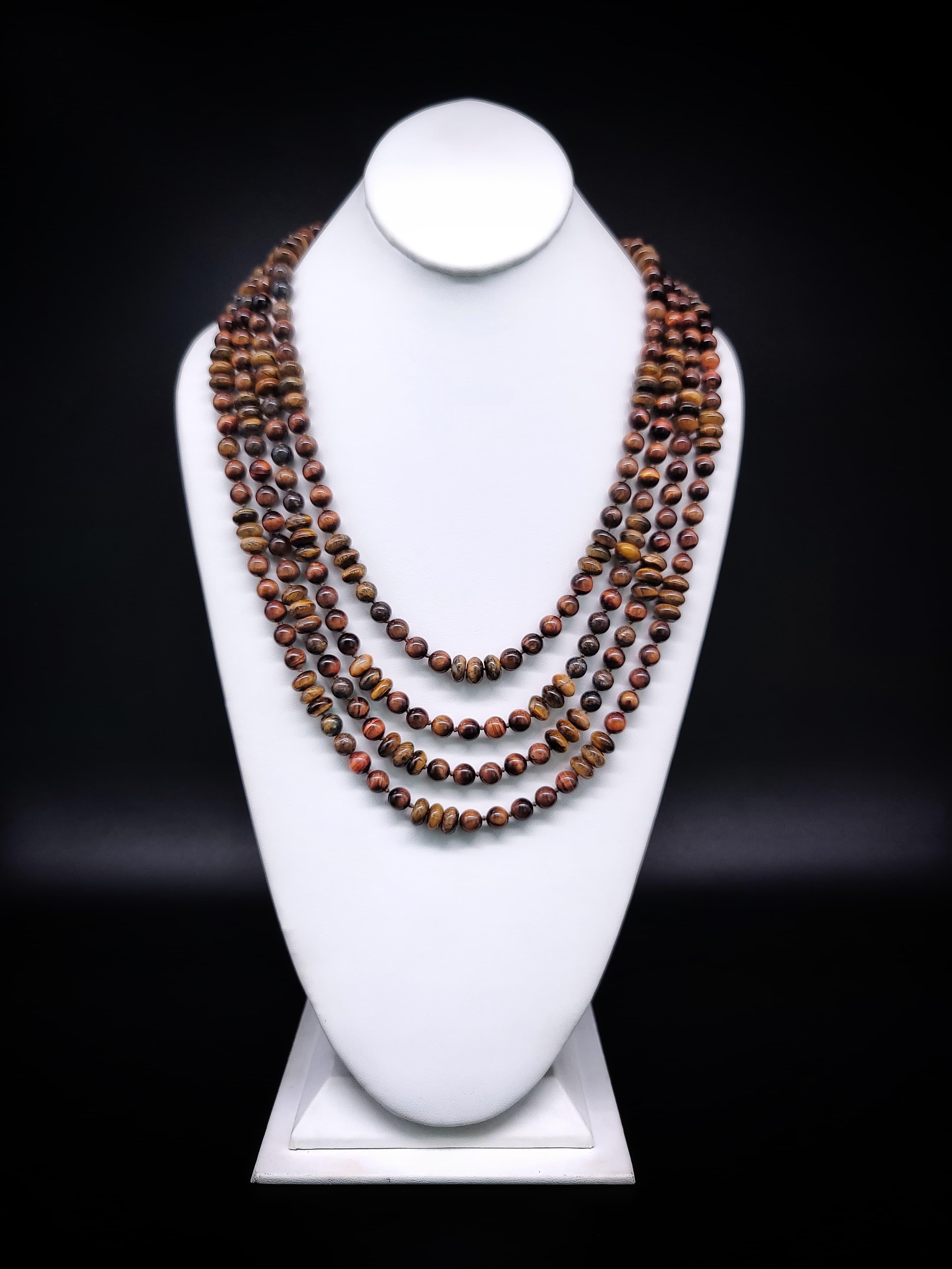 One-of-a-Kind

Prepare to be mesmerized by our one-of-a-kind Endlessly Intriguing and Sophisticated 4-Strand Tiger's Eye necklace. This necklace features four strands of perfectly matched Tiger's Eye beads that graduate in size from 6-8mm, creating