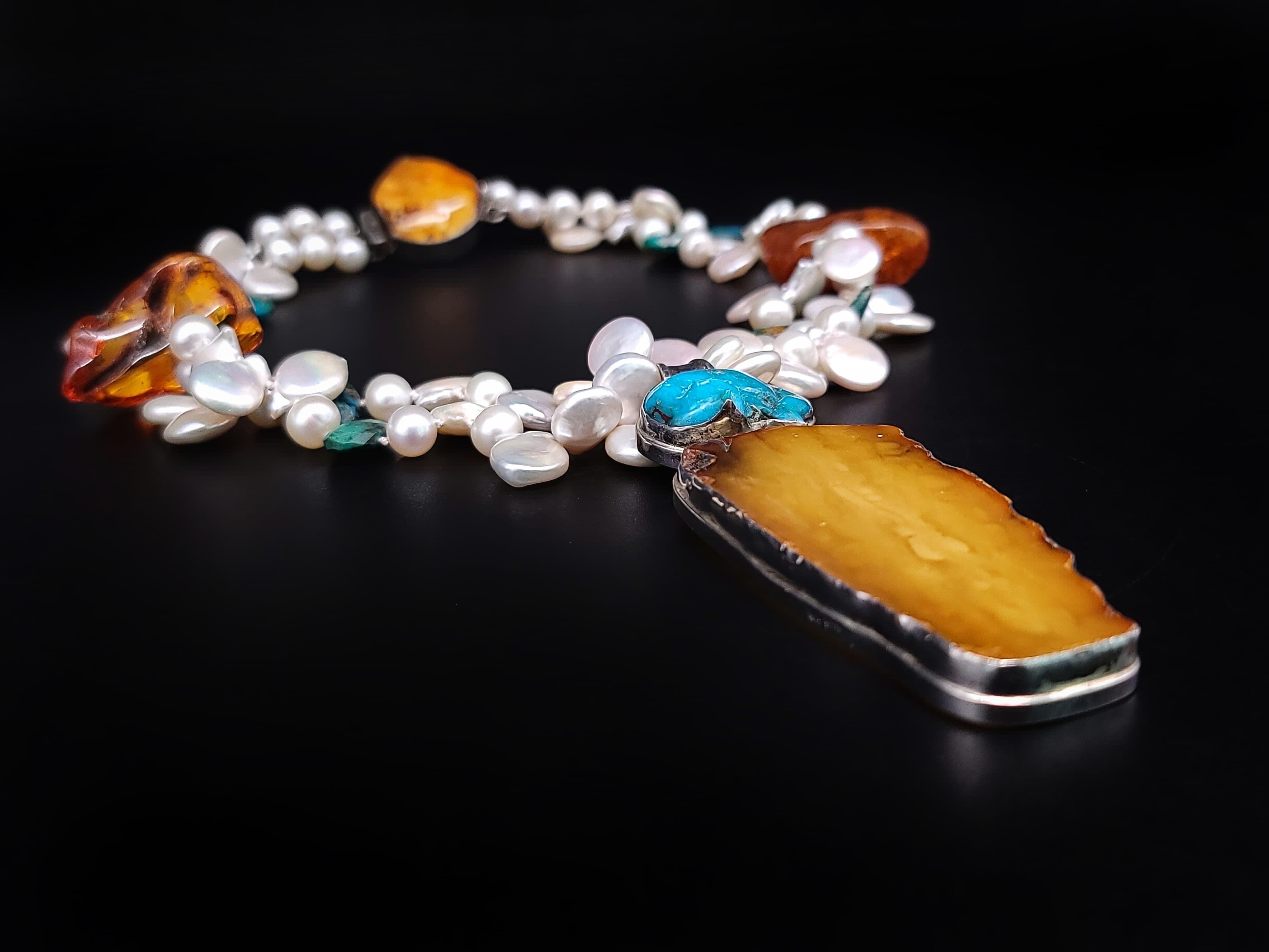 Mixed Cut A.Jeschel Pearl necklace with spectacular Amber pendant. For Sale