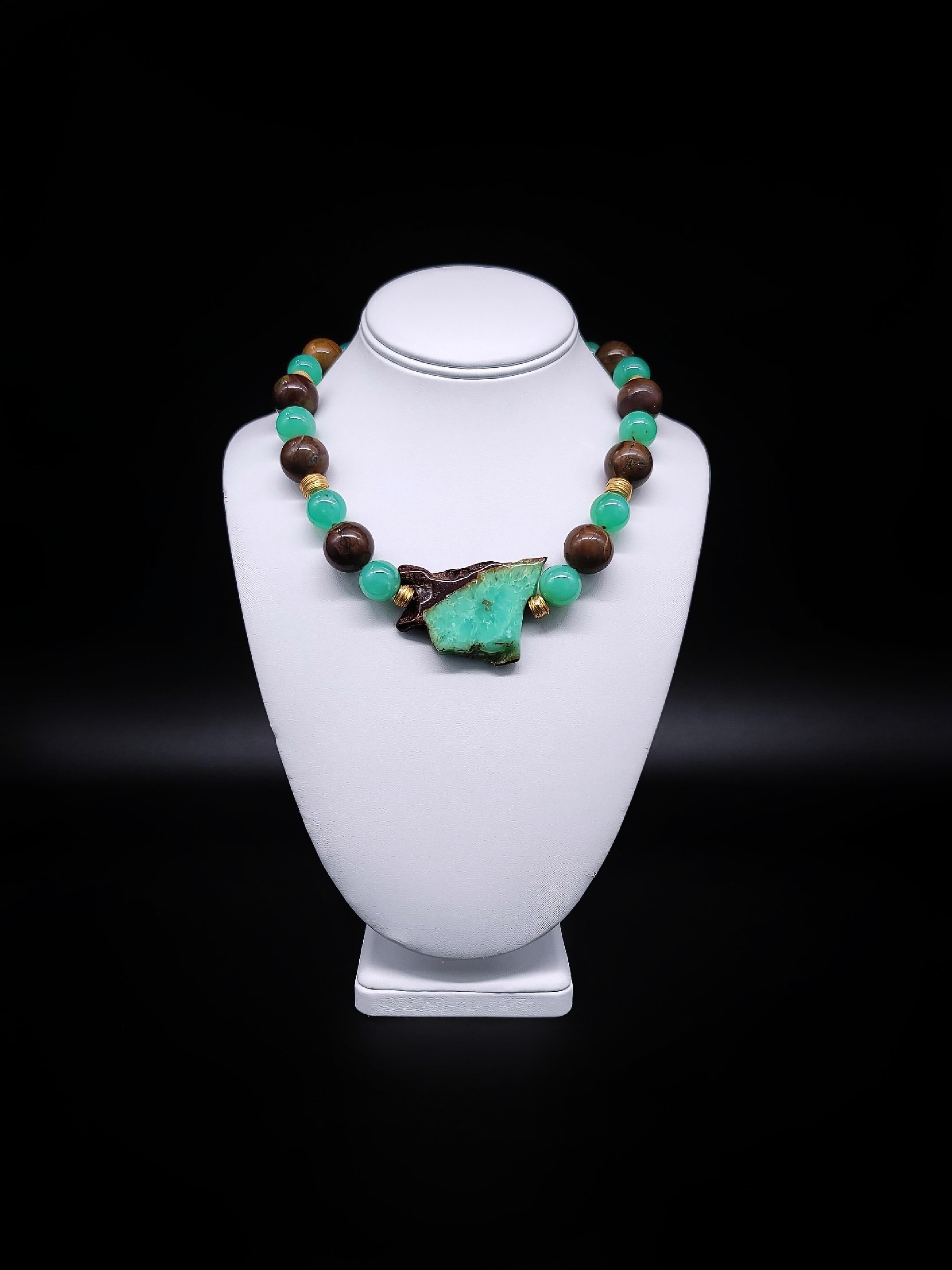 One-of-a-Kind
Mixed with Tiger’s eye beads. The beads surround a slice of polished Chrysoprase with a corner of dark brown. An exclusion caused by the expected bit of nickel found in the mine. Hand made Vermeil spacers and clasp with a Tiger's eye
