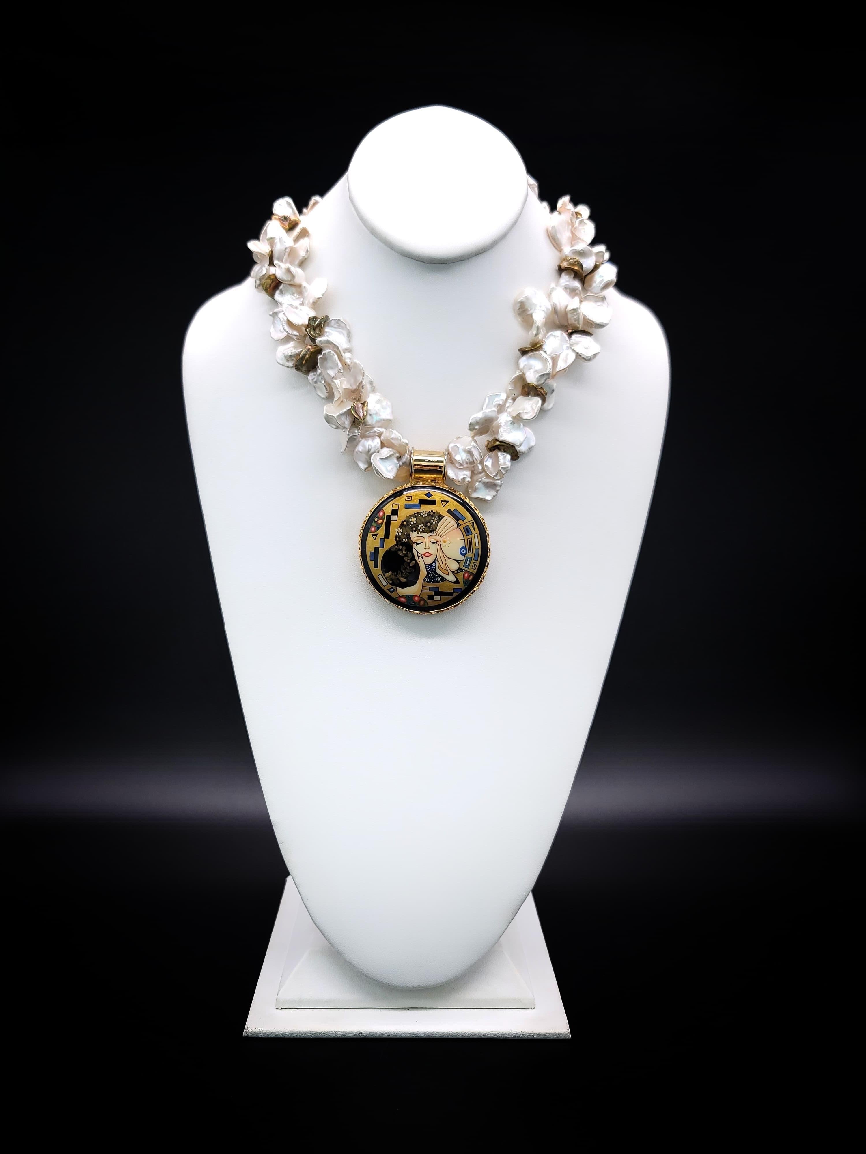 One-of-a-Kind 

Experience the enchanting allure of Art Deco with this stunning necklace, a magical creation born from the imagination of an art miniaturist who discovered an unforgettable image.

The iconic Gustav Klimt gold design is carefully