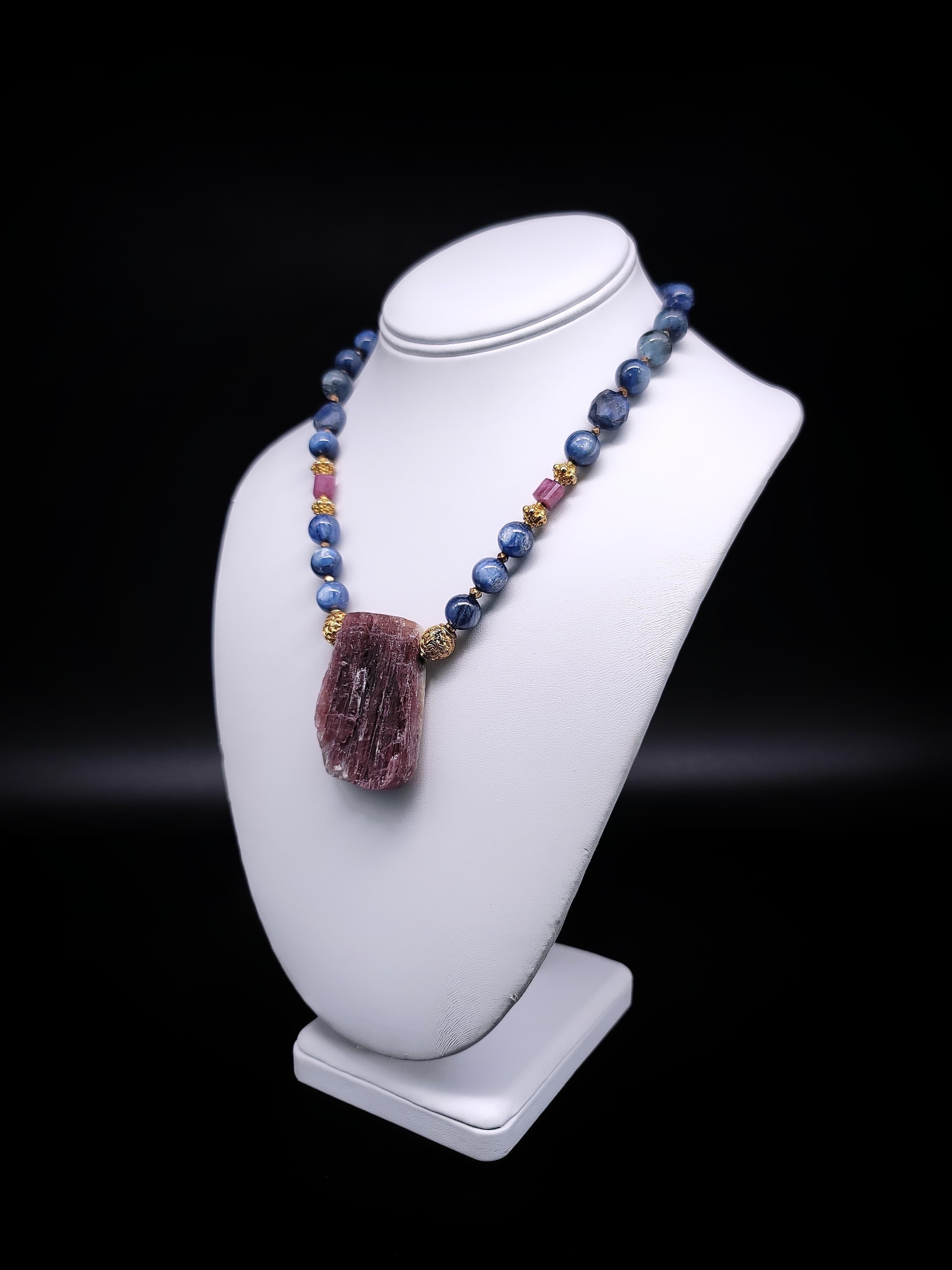 Elevate your jewelry collection with this truly exceptional one-of-a-kind necklace. Rich blue Kyanite and sapphire gemstones, adorned with a delicate touch of Tourmaline, harmoniously come together with the opulence of vermeil (22-karat gold over