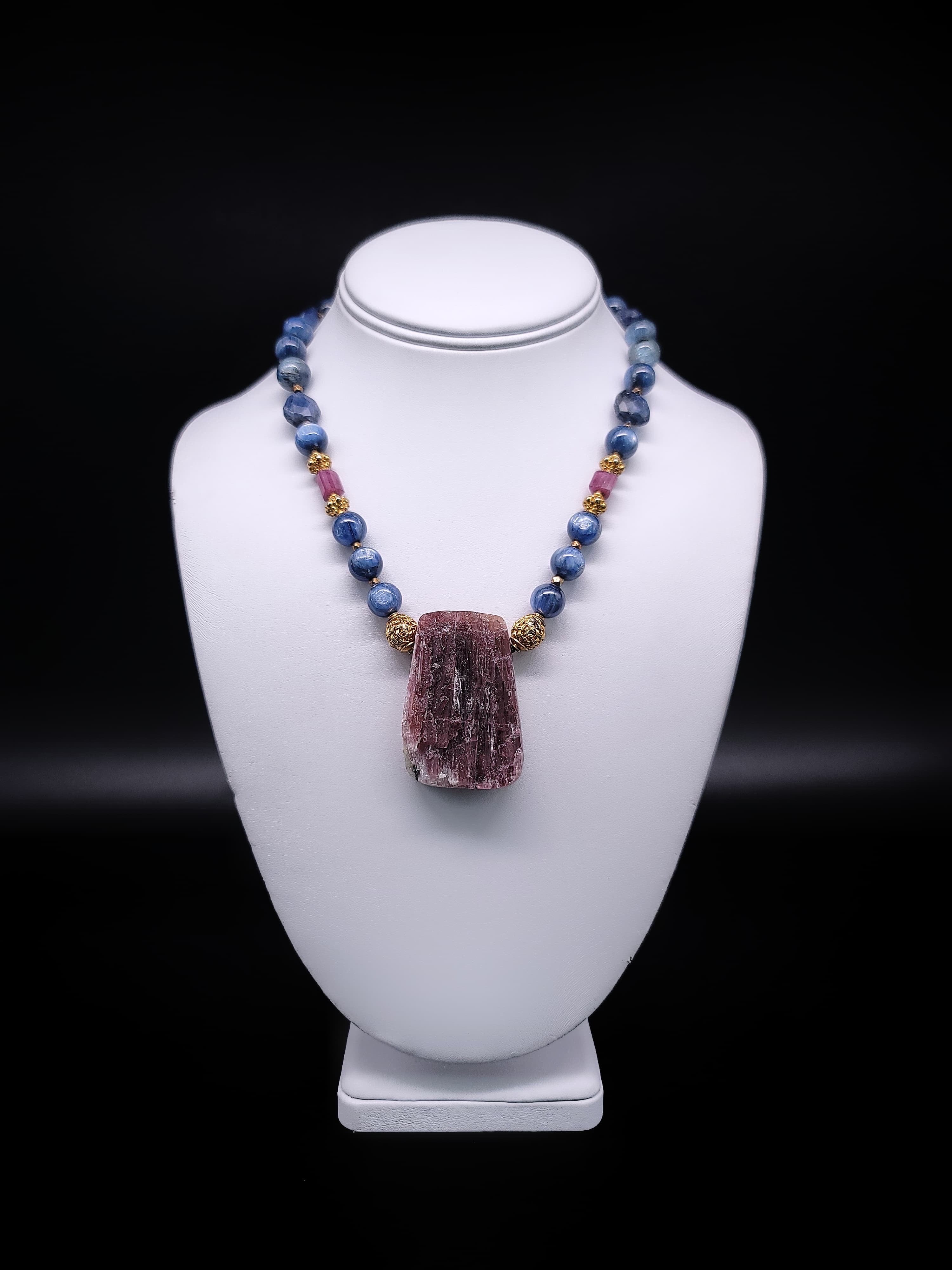 Elevate your jewelry collection with this truly exceptional one-of-a-kind necklace. Rich blue Kyanite gemstones, and faceted sapphire adorned with a delicate touch of Tourmaline, harmoniously come together with the opulence of vermeil (22-karat gold