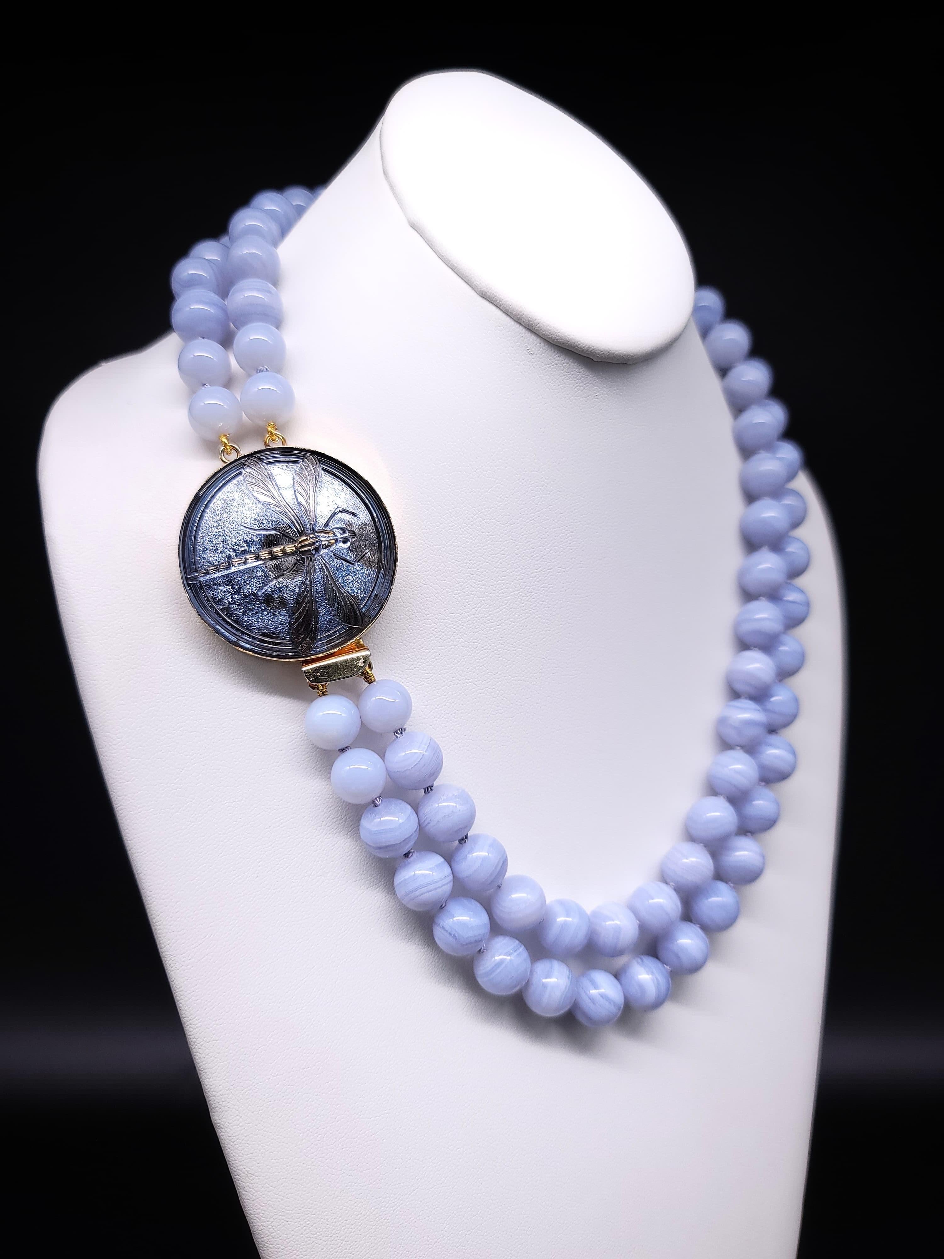 One-of-a-Kind

Indulge yourself in the ultimate luxury with our latest Blue Lace Agate gemstone necklace addition, a stunning and unique cousin to Chalcedony. The soft blue hue of the natural blue lace agate and the subtle banding of this gemstone