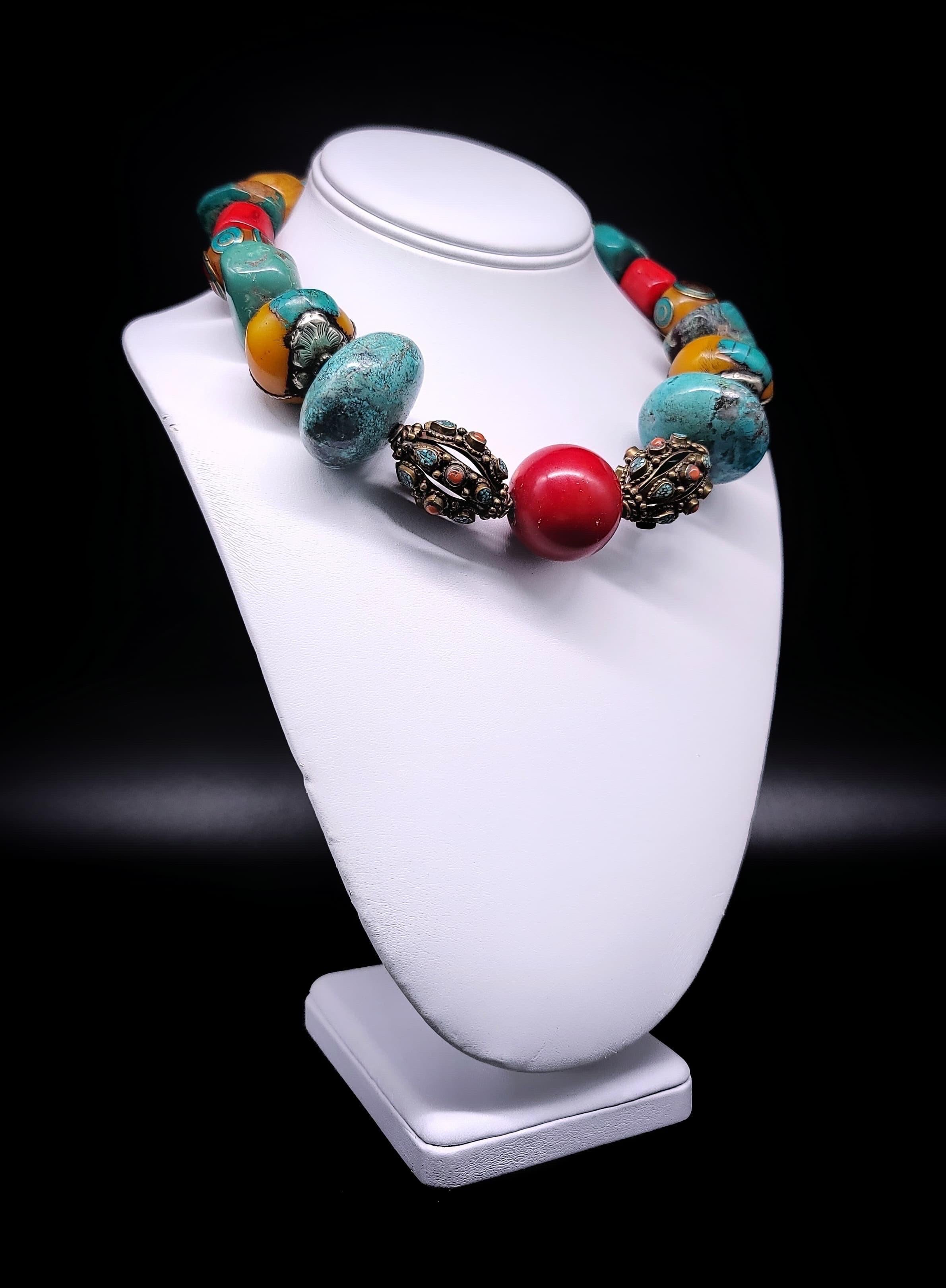 Discover a one-of-a-kind masterpiece that beautifully blends a kaleidoscope of stones sourced from diverse corners of the globe. This captivating necklace is a harmonious symphony of coral, turquoise, amber, and copal, offering an electrifying burst