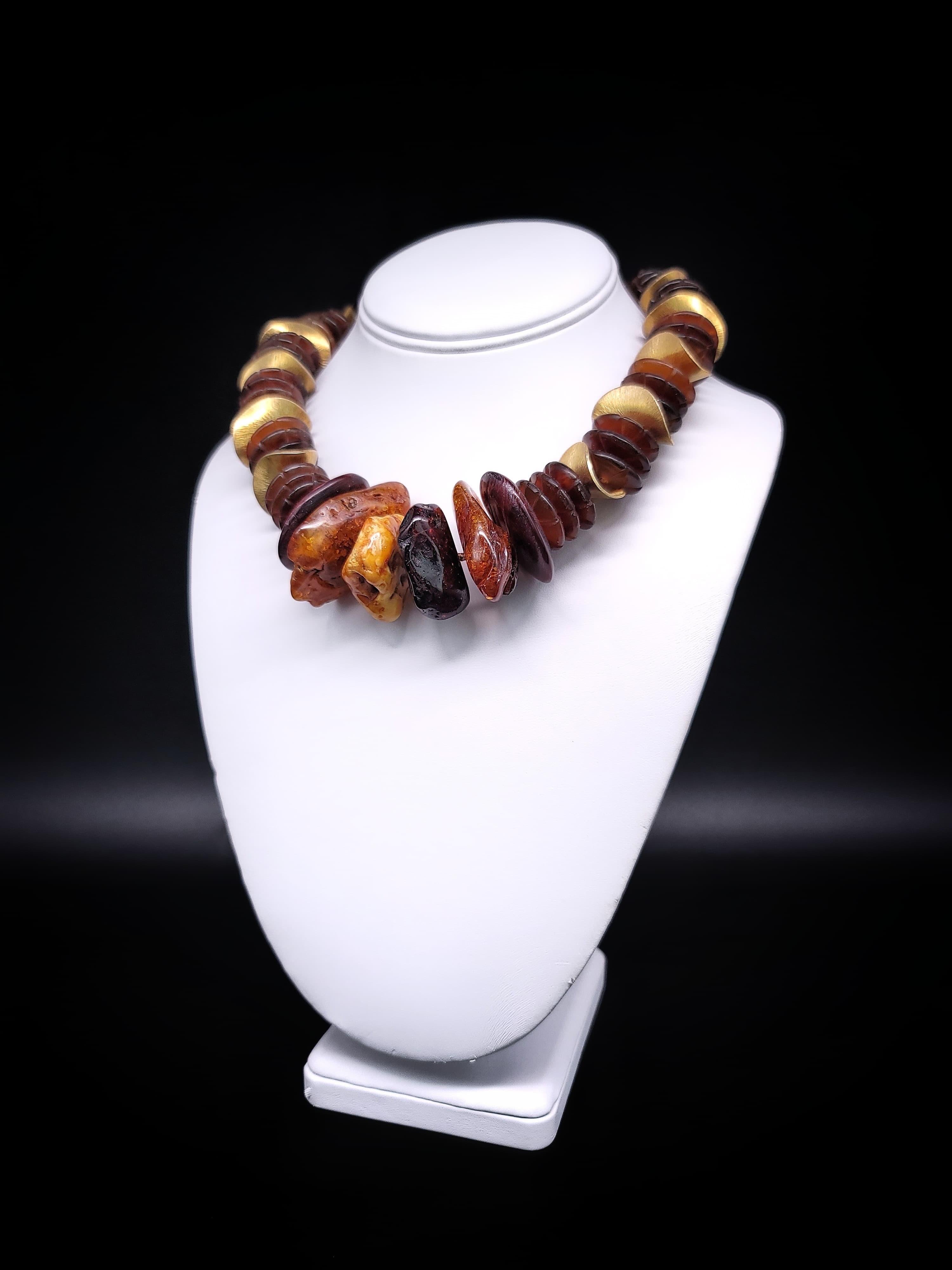 This one-of-a-kind necklace is a unique blend of different elements that come together in perfect harmony. The warm, honey-colored Baltic Amber beads and intricately polished and carved wooden beads from the Philippines make for an unusual yet
