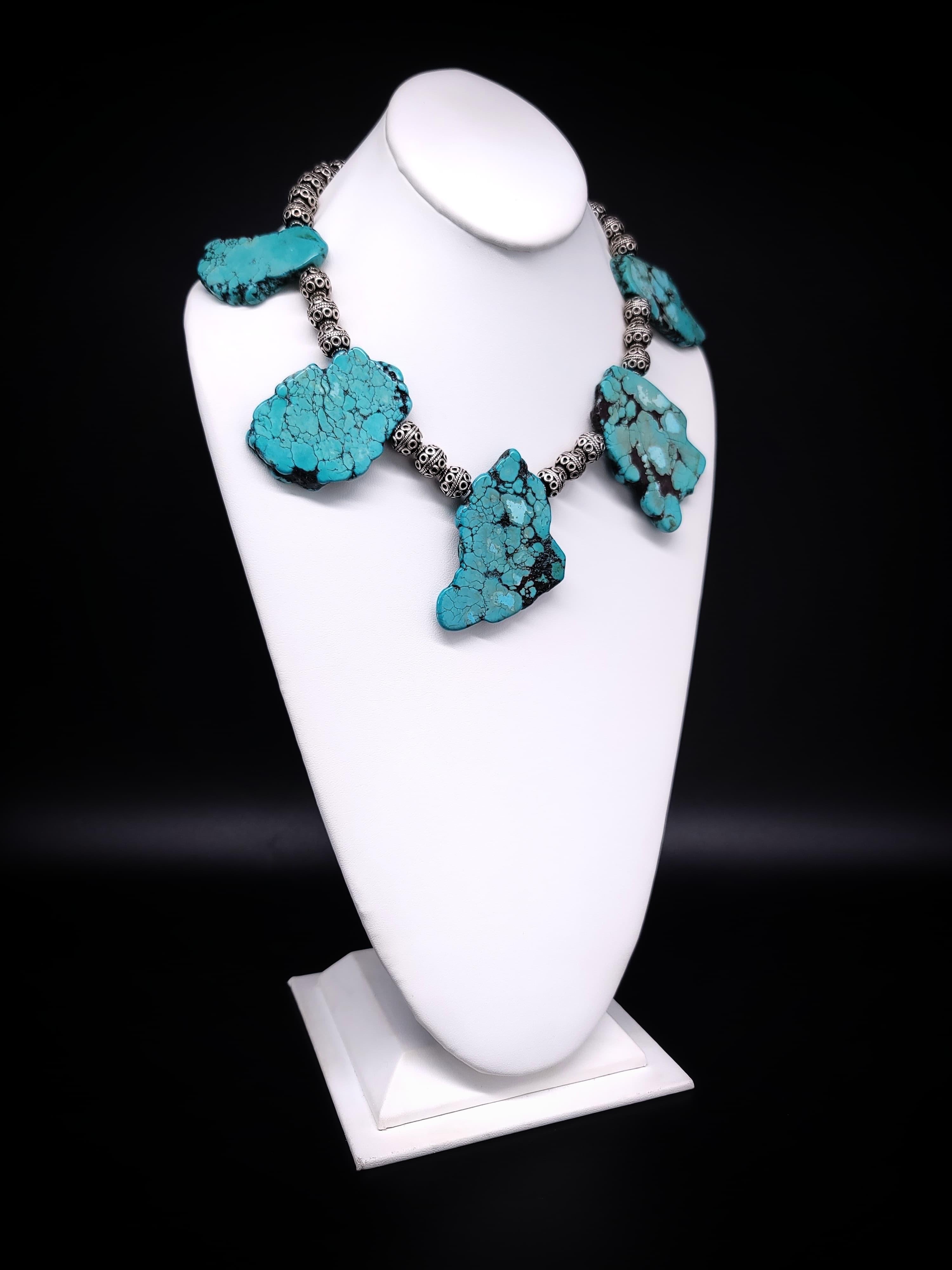 One-of-a-Kind.

Introducing the bold and massive hunks of Turquoise necklace, a true statement piece that embodies strength and elegance. The sheer weight and size of the Turquoise stones, coupled with the sturdy Sterling Silver beads from Bali,
