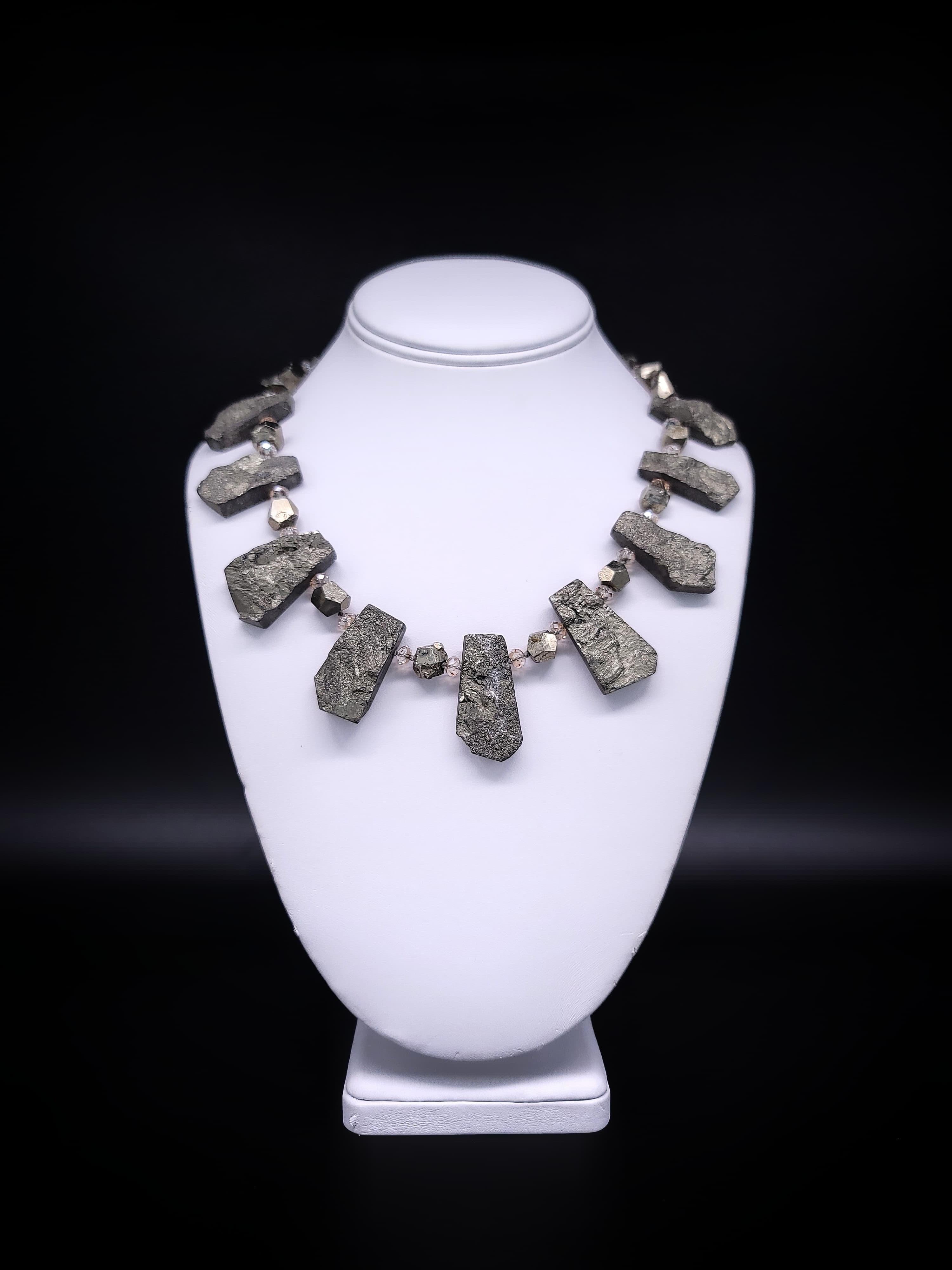 One-of--a-Kind

Introducing our latest fashion statement piece, featuring the captivating Pyrite gemstone necklace. This gemstone has a fascinating history, as it was discovered in prehistoric burial mounds and is named after the Greek word for