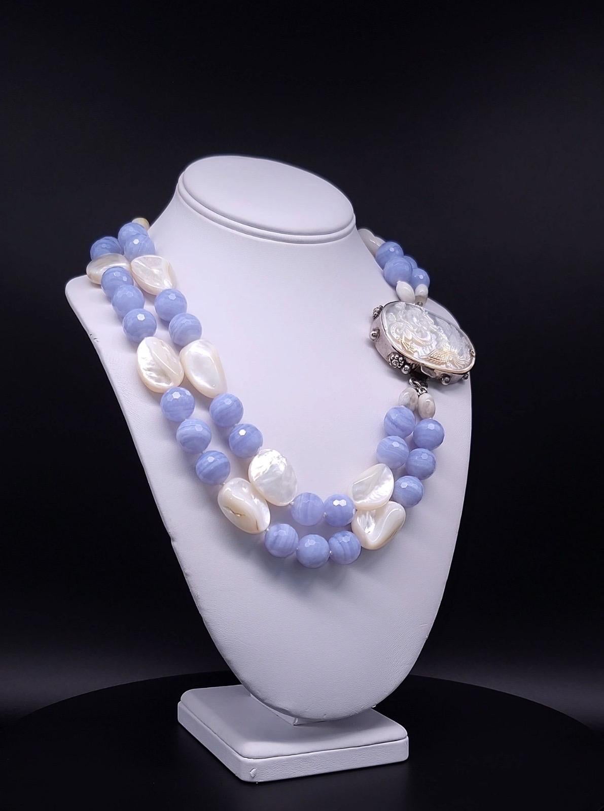 One-of-a-Kind

This stunning piece of jewelry boasts a celestial combination of faceted sky blue lace 16m.m beads and polished mother-of-pearl beads that resemble fluffy clouds. The sterling silver clasp features a beautifully carved mother-of-pearl