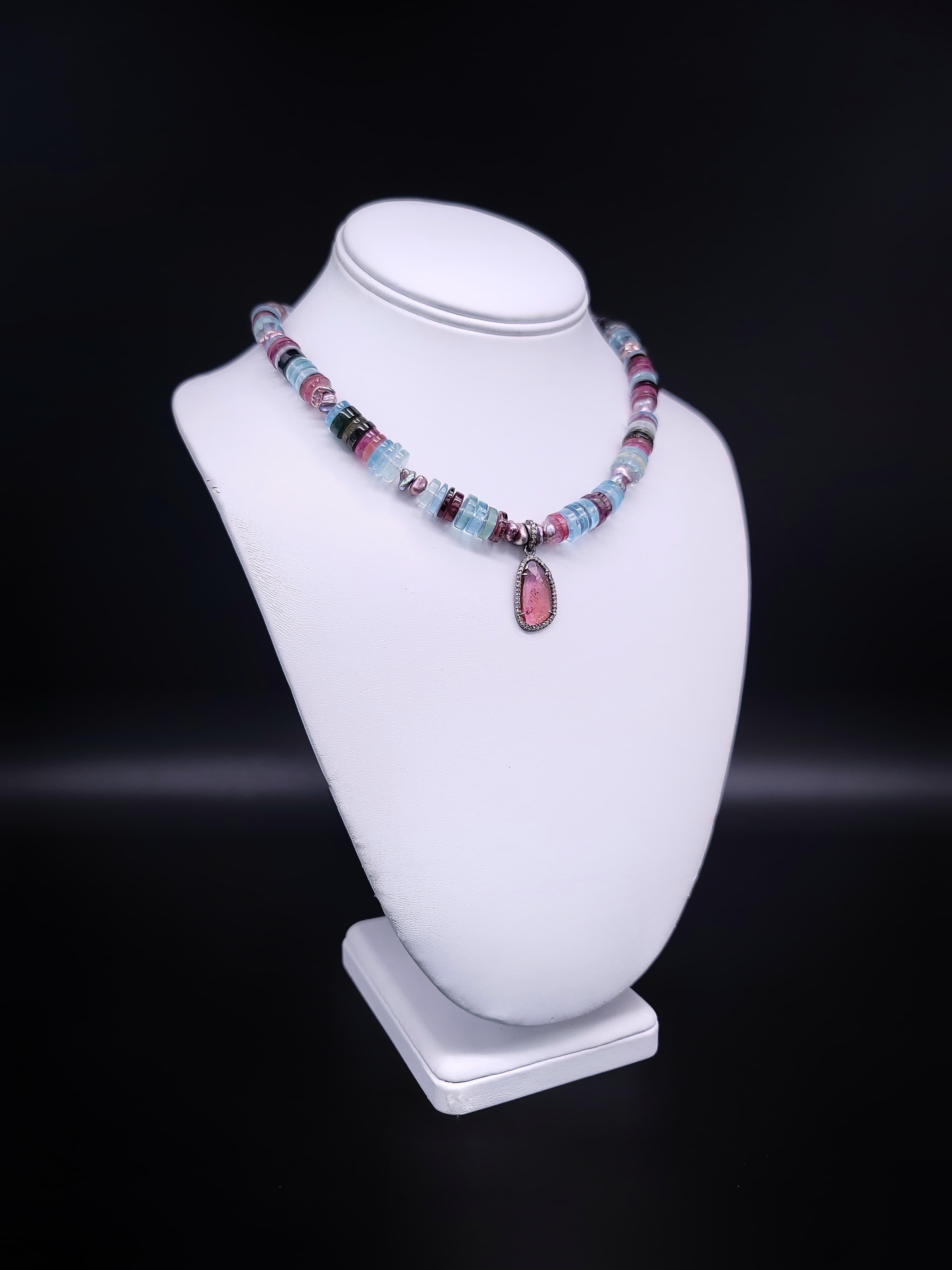 One-of-a-Kind 
Introducing the stunning Watermelon Tourmaline and Aquamarine necklace, a beautifully colored strand that exudes elegance and sophistication. Meticulously matched shades of dark green to pink Watermelon Tourmaline are complemented by