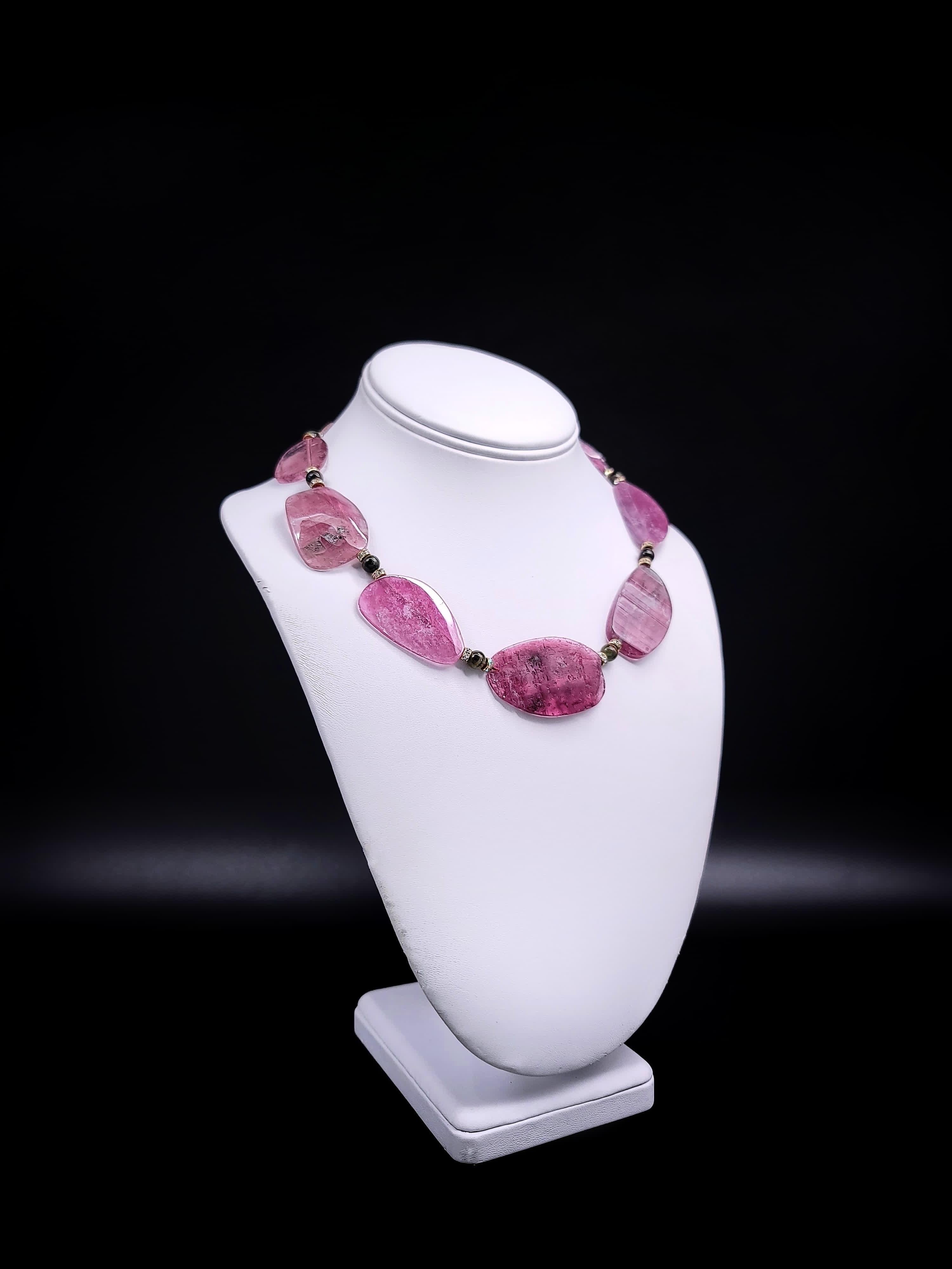 One-of-a-Kind

Elevate your jewelry collection with this extraordinary Tourmaline Necklace, featuring an unusual cut that showcases the stone's unique translucency and depth of color. Unlike the more common faceted or polished tourmalines, these