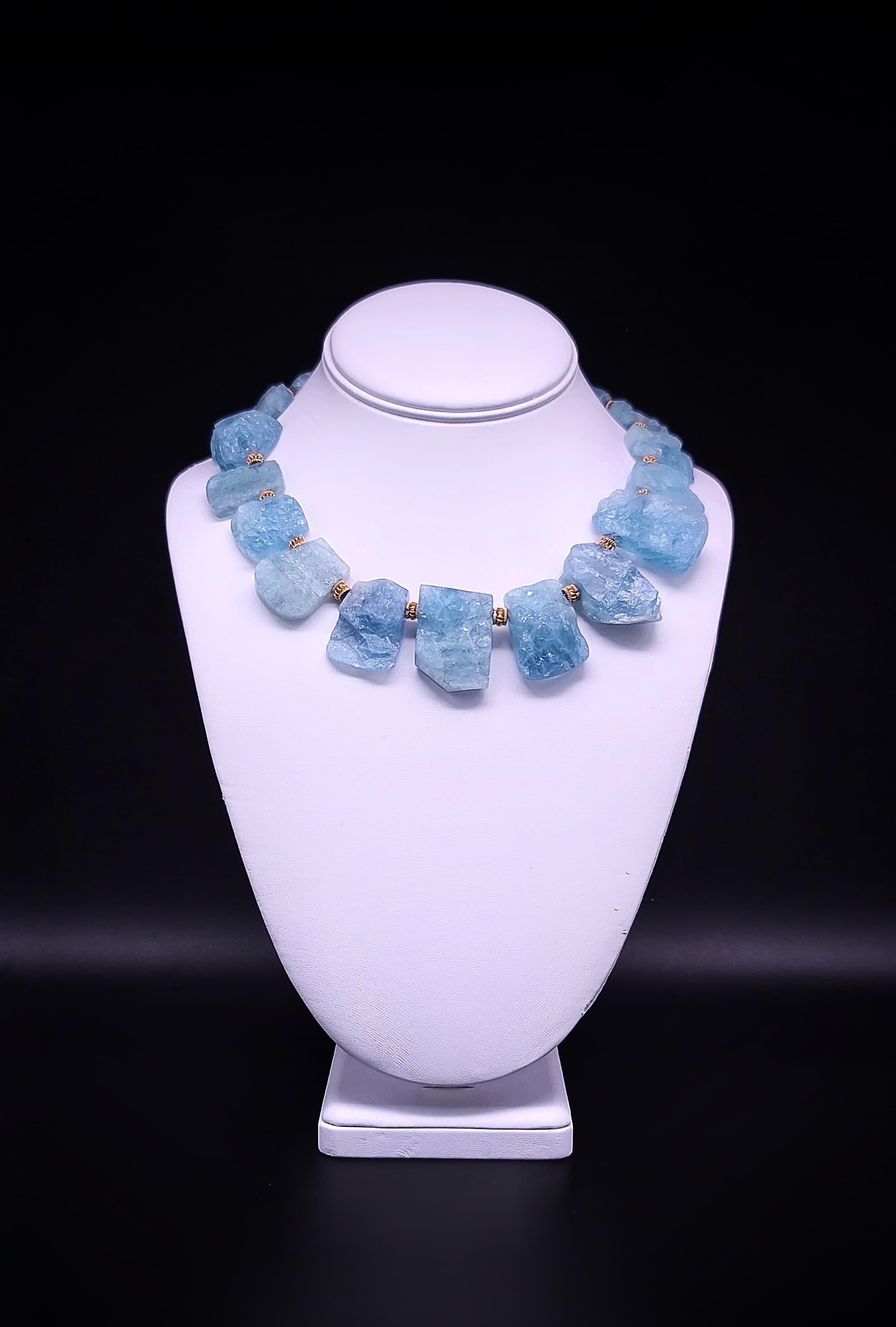 One-of-a-Kind

Richly colored Natural Aquamarine makes up this collar of rough-cut plates that surround the neck “ just so.”. The carefully matched plates are rough on the front side to capture the light and reflect it to make the presentation most
