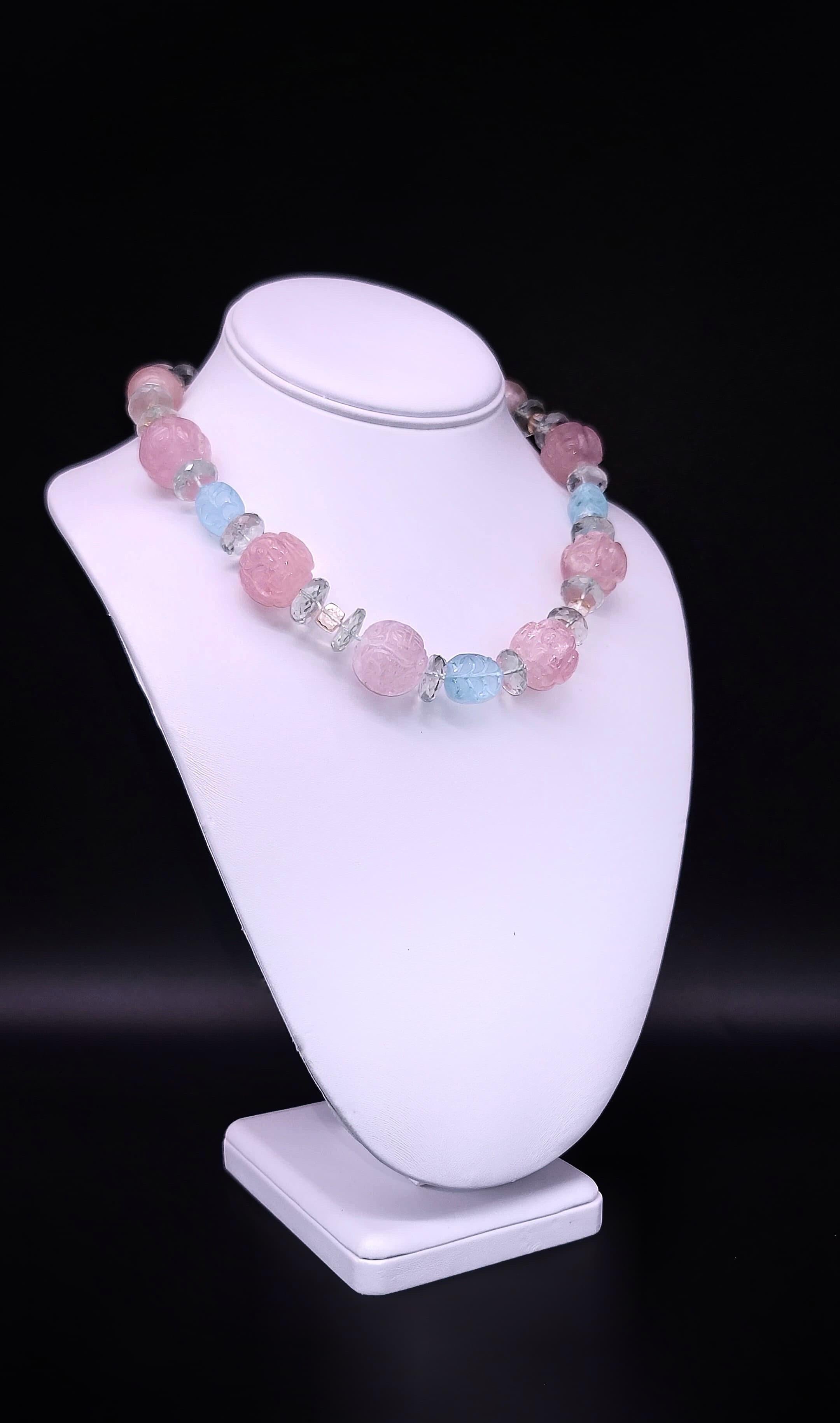Indulge in the ethereal beauty of this enchanting necklace, where romance meets elegance in a harmonious blend of delicate hues. Crafted with meticulous care, it features exquisite Carved Rose Quartz beads symbolizing love and longevity, gracefully