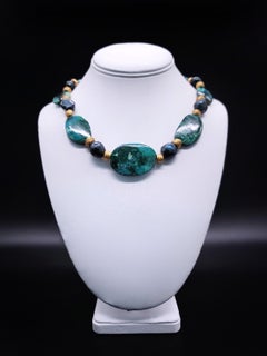 A.Jeschel Gem Silica necklace separated by green peacock Baroque Pearls.