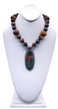 A.Jeschel Collier puissant à un seul brin en forme d'œil de tigre avec pendentif chrysocolla.