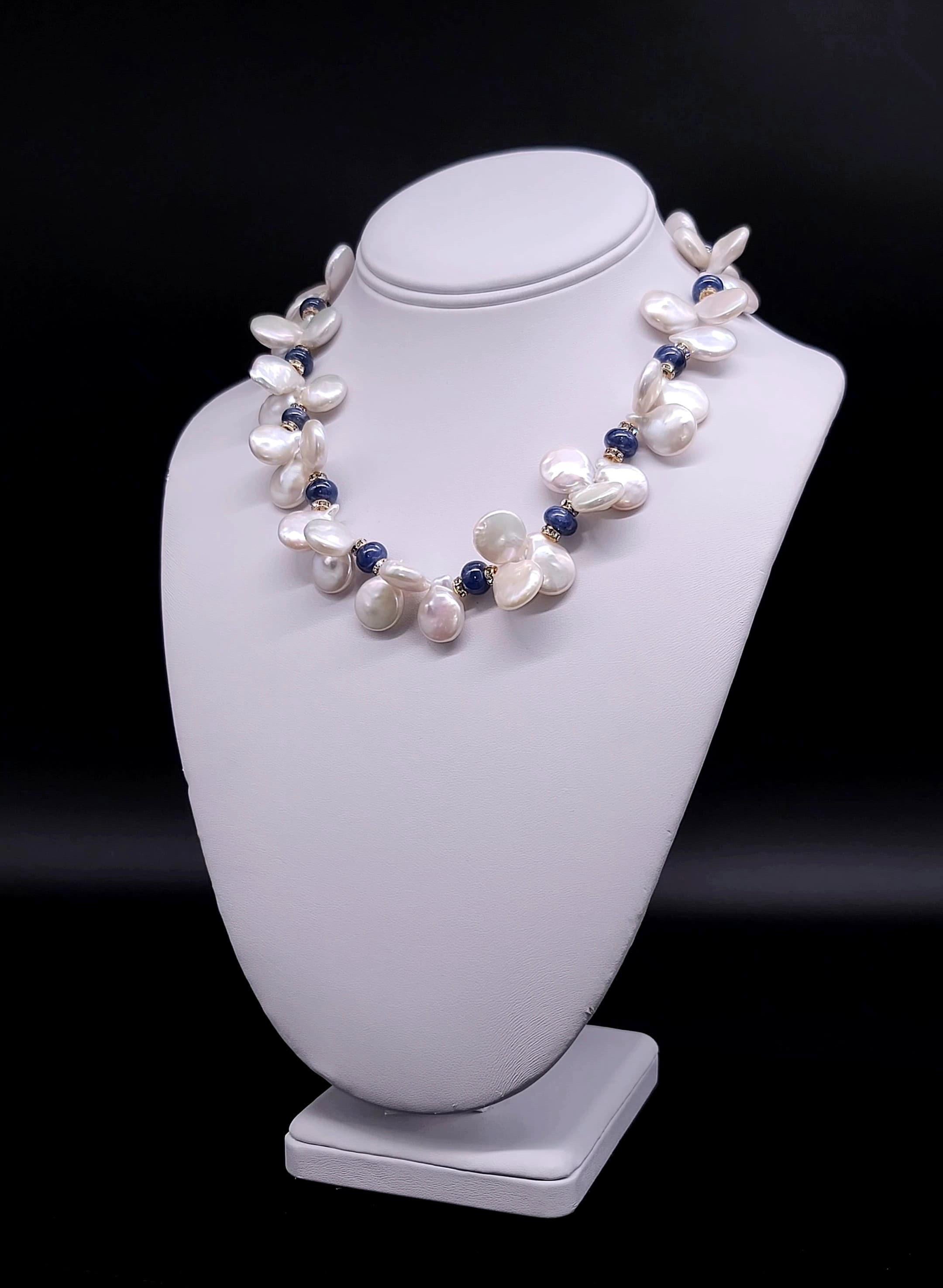 This One-of-a-Kind Silk Hand-Knotted Necklace is an exquisite blend of sophistication and natural beauty, showcasing polished sapphire spacers paired with lustrous Freshwater Keshi Pearls. Each element is chosen with care to create a piece that is