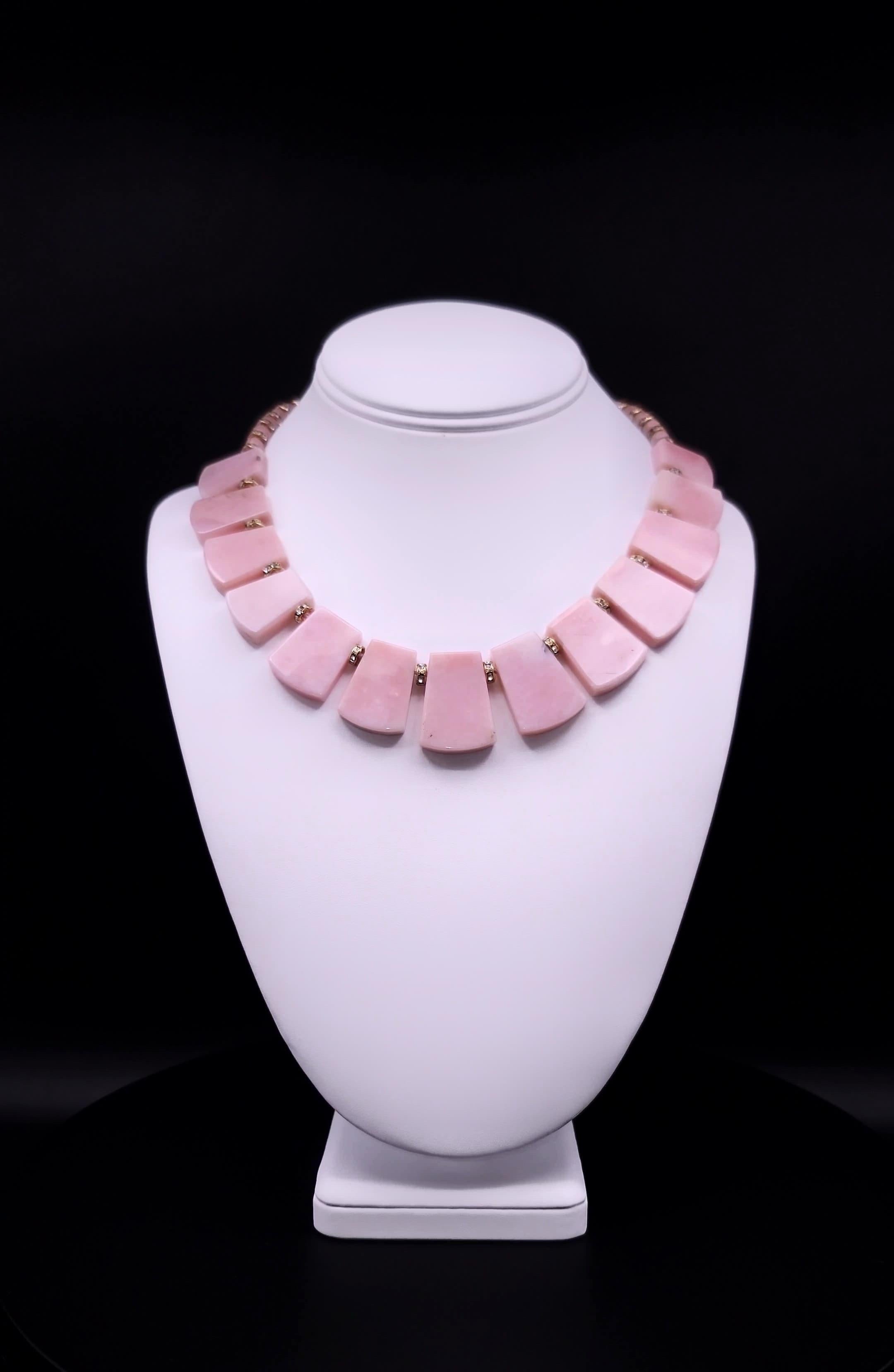 This one-of-a-kind necklace is a true delight for lovers of pink hues and opal gemstones. These stunning opals exhibit a range of hues, from soft blush to deep rose, creating a mesmerizing visual effect that is both elegant and modern.

The opal