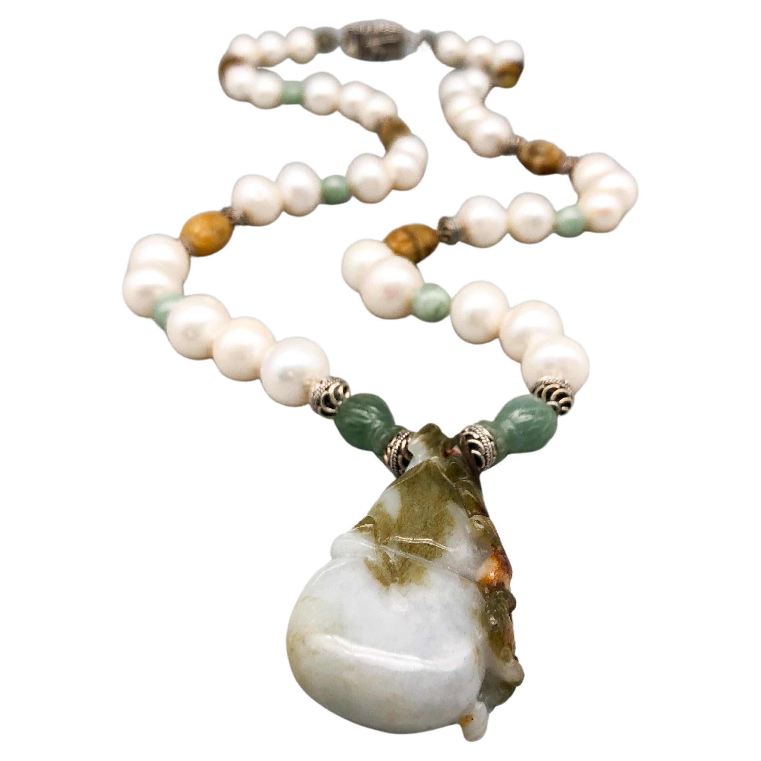 A.Jeschel Carved Jade and Freshwater Pearls make a Stunning Long Necklace.