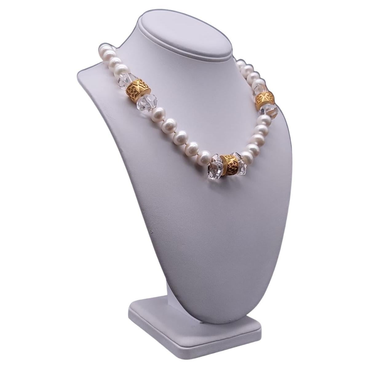 One-of-a-Kind

This elegant necklace features a single strand of 12mm pearls, which are interrupted by three stunning assemblages of cut crystal stones and 3/8