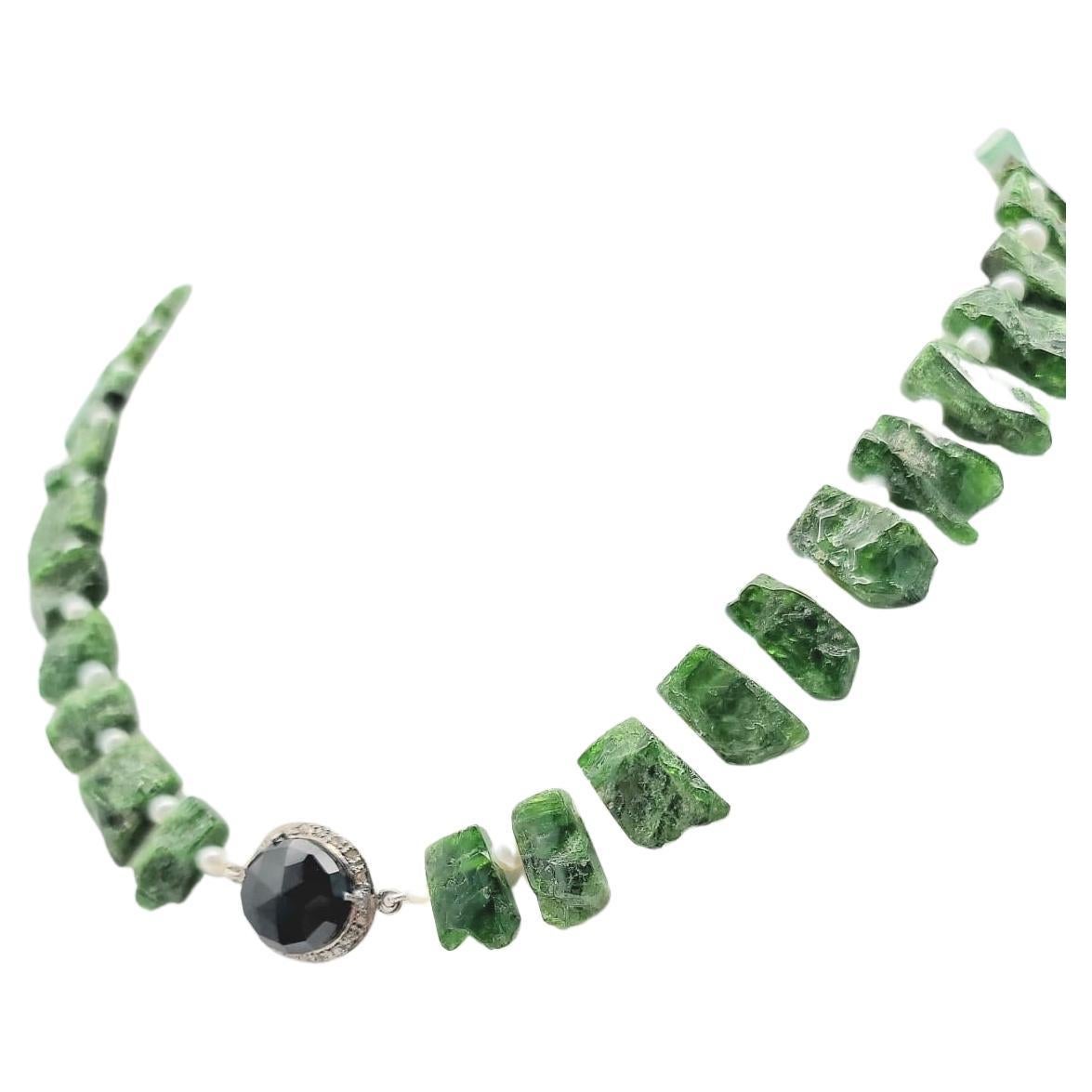 One-of-a-Kind

Introducing a truly stunning necklace, featuring vivid deep green chrome Diopside gemstones. This recently discovered gemstone is found almost exclusively in Eastern Siberia and is known as Inagli. Each stone in this necklace has been