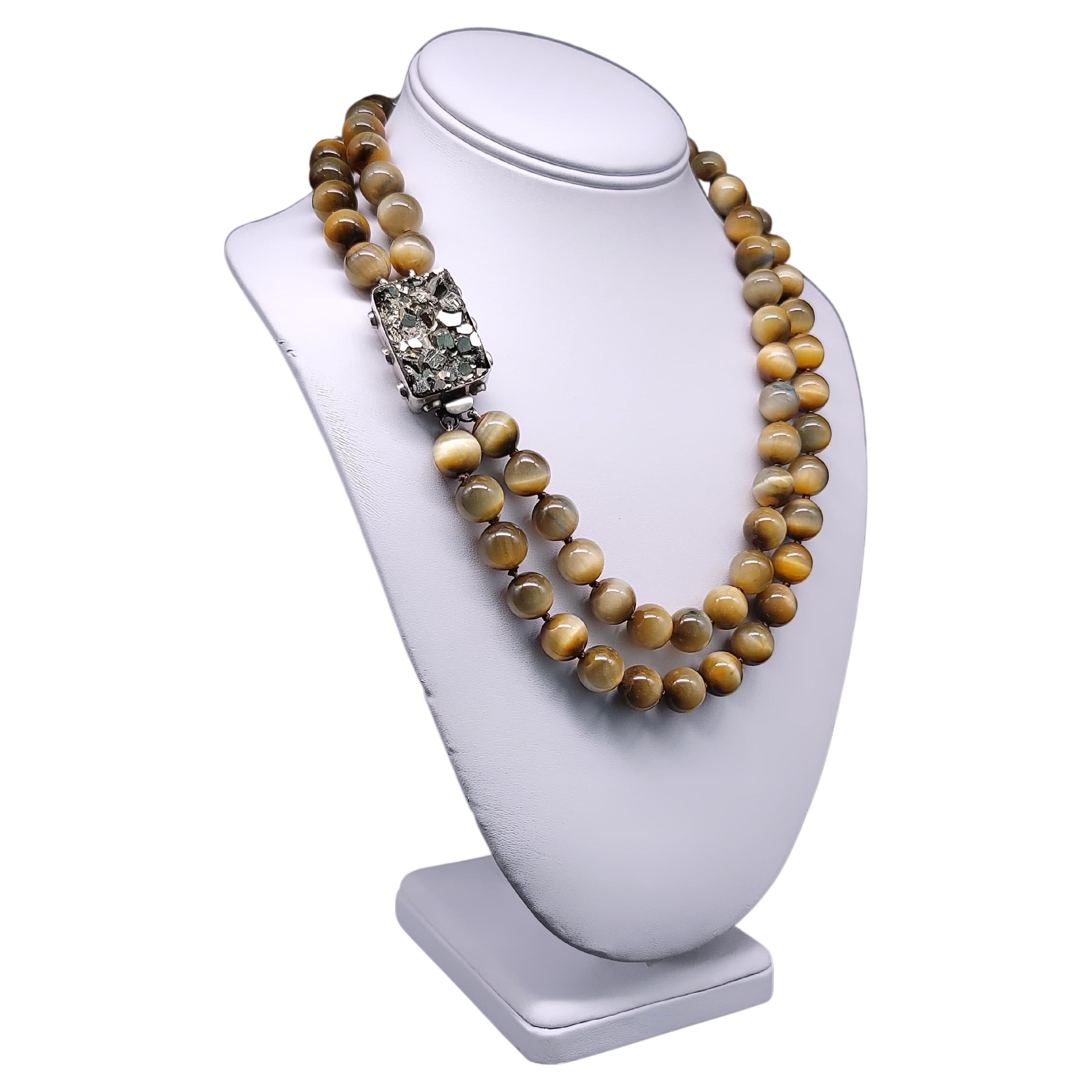 A.Jeschel Honey Tiger’s eye necklace combined with Pyrite clasp.