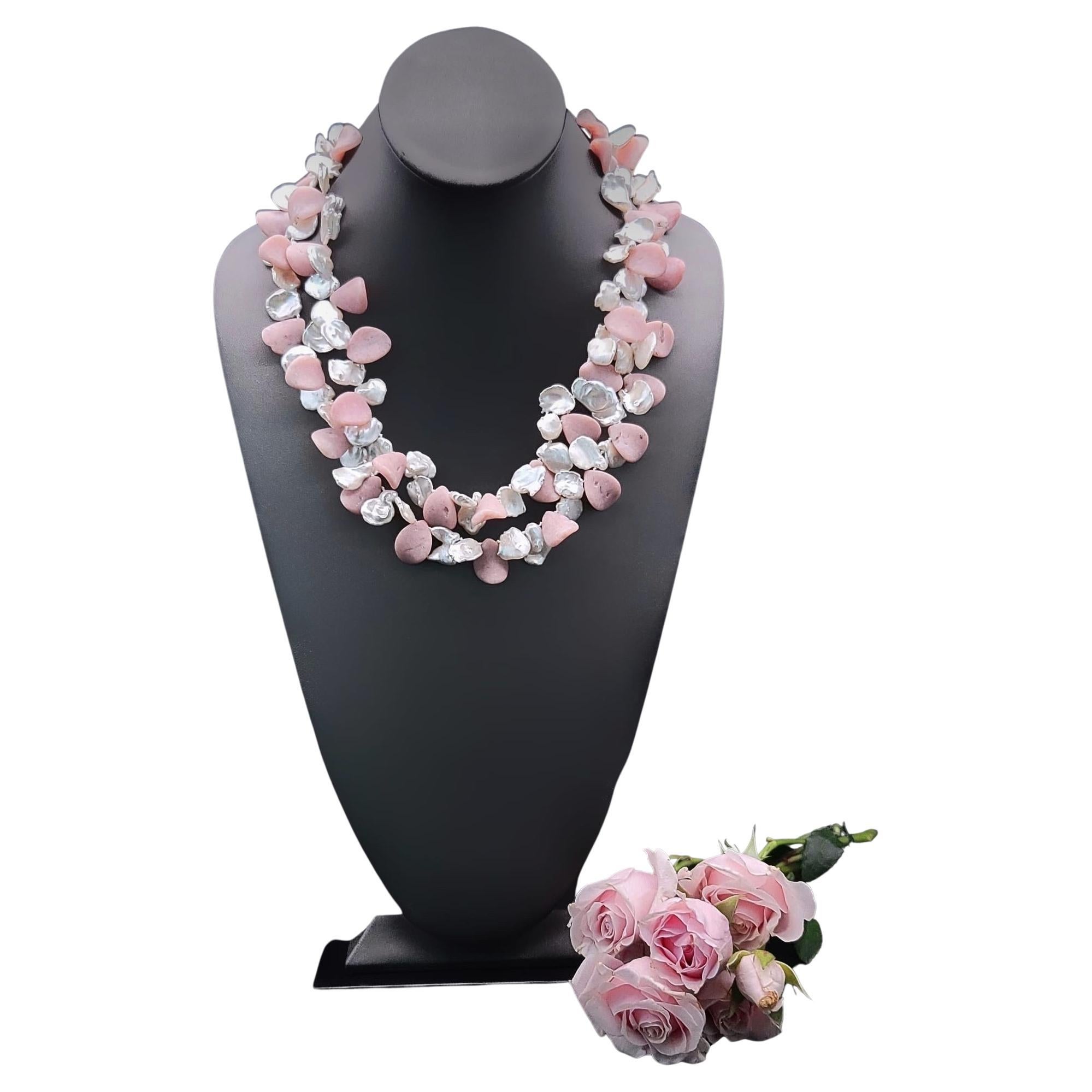 One-of-a-Kind
 
Both the Opals and pearls are petal-shaped forming a very feminine pink and white ruffle. The clasp is a polished Morganite stone set in Sterling silver. Which is very attractive worn on the side.
Silk hand-knotted
Approx: 20 inch
