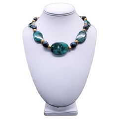 A.Jeschel Gem Silica necklace separated by green peacock Baroque Pearls.