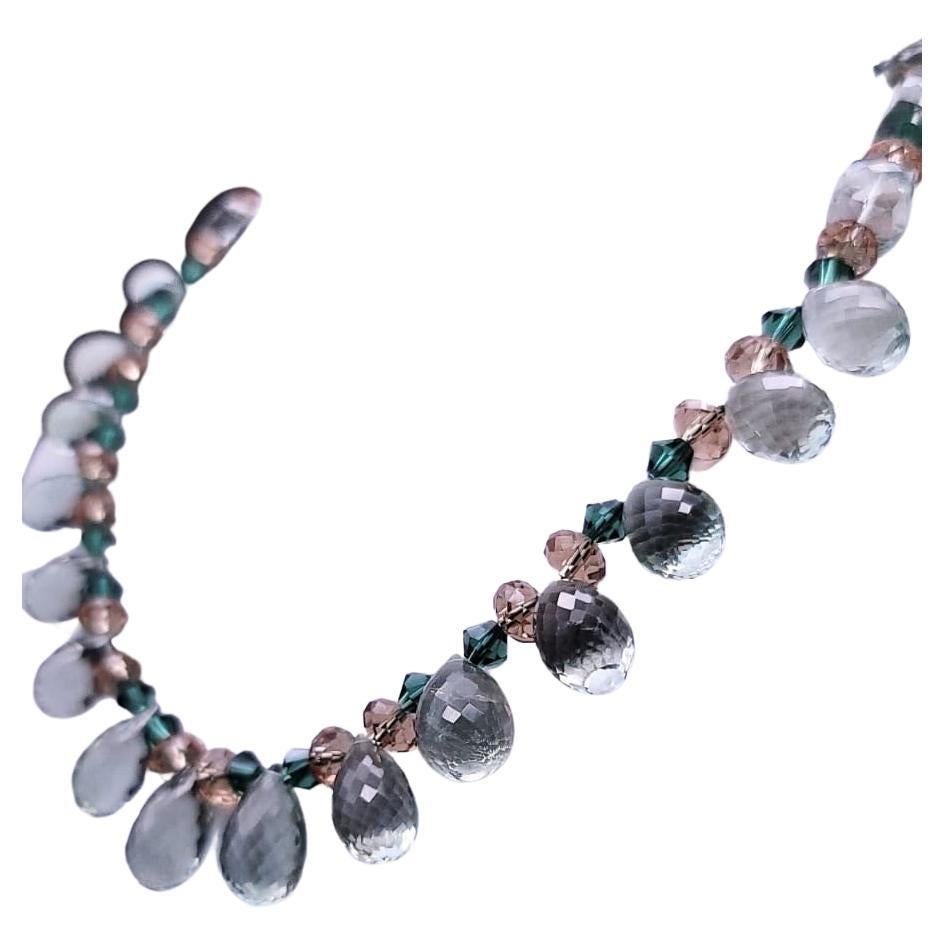 One-of-a-Kind

An elegant “pretty woman” necklace of soft Green Amethyst facetted teardrops. The drops are separated by Citrine and Swarovski Crystal spacers. The clasp is a vintage glass button set in a vermeil box. Beautifully designed necklace a
