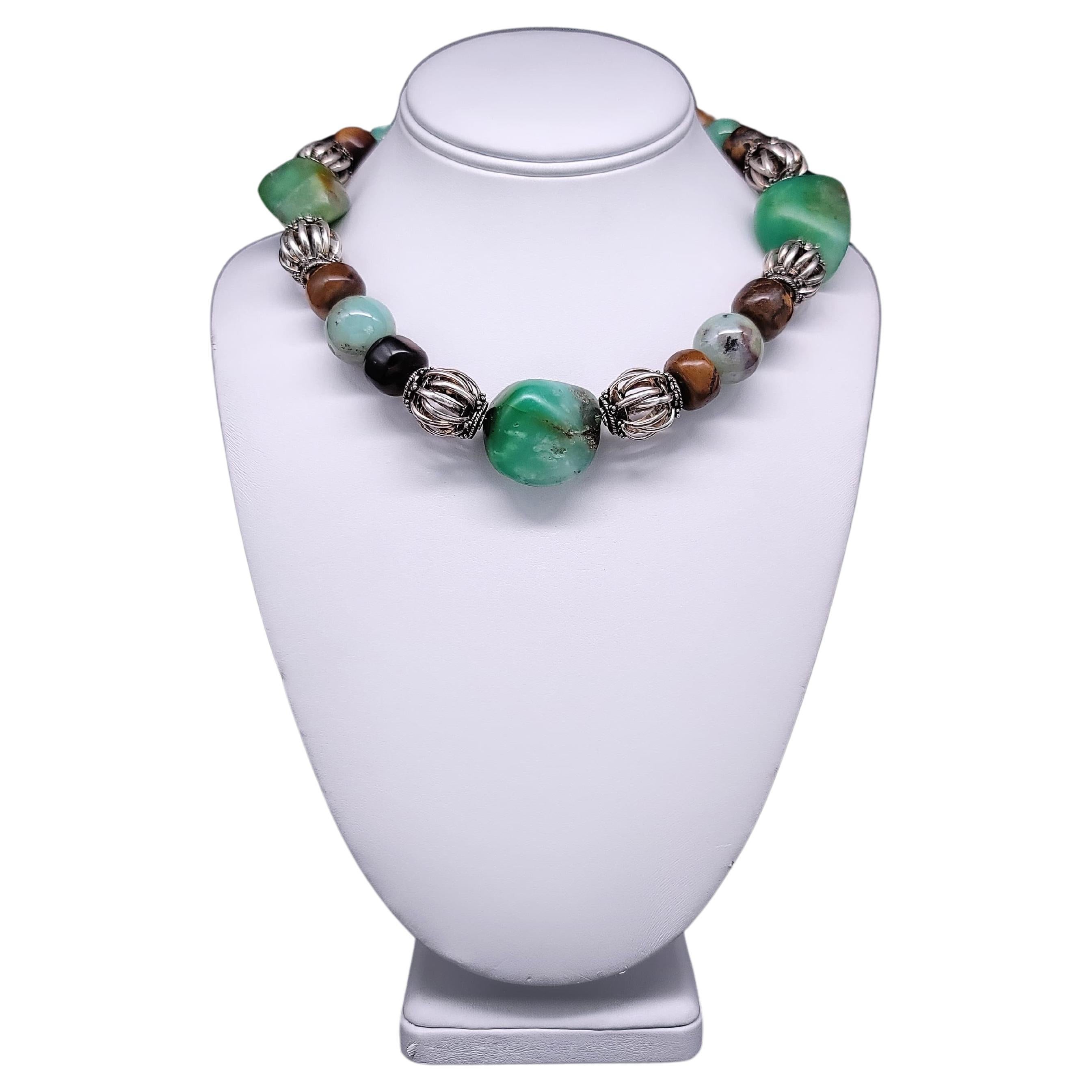 Exquisite Rarity:

Prepare to be captivated by a truly exceptional creation that stands alone in its uniqueness. At its heart, an extraordinary large opaque green polished Chrysoprase center stone takes the spotlight, its vibrant beauty a testament