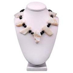 A.Jeschel Rough White Opal bold necklace with a Vintage cameo.