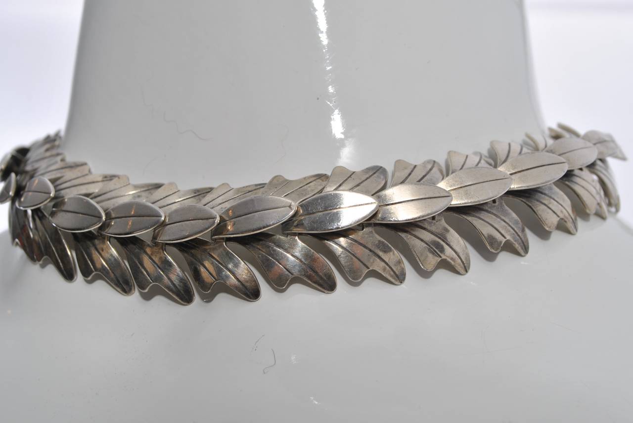 Mid-twentieth-century artist Rebajes was known for his copper and silver jewelry. Many of his pieces incorporated the leaf motif, as in this choker made of     repeating leaf segments connected so they contour around the collar bone. Not marked