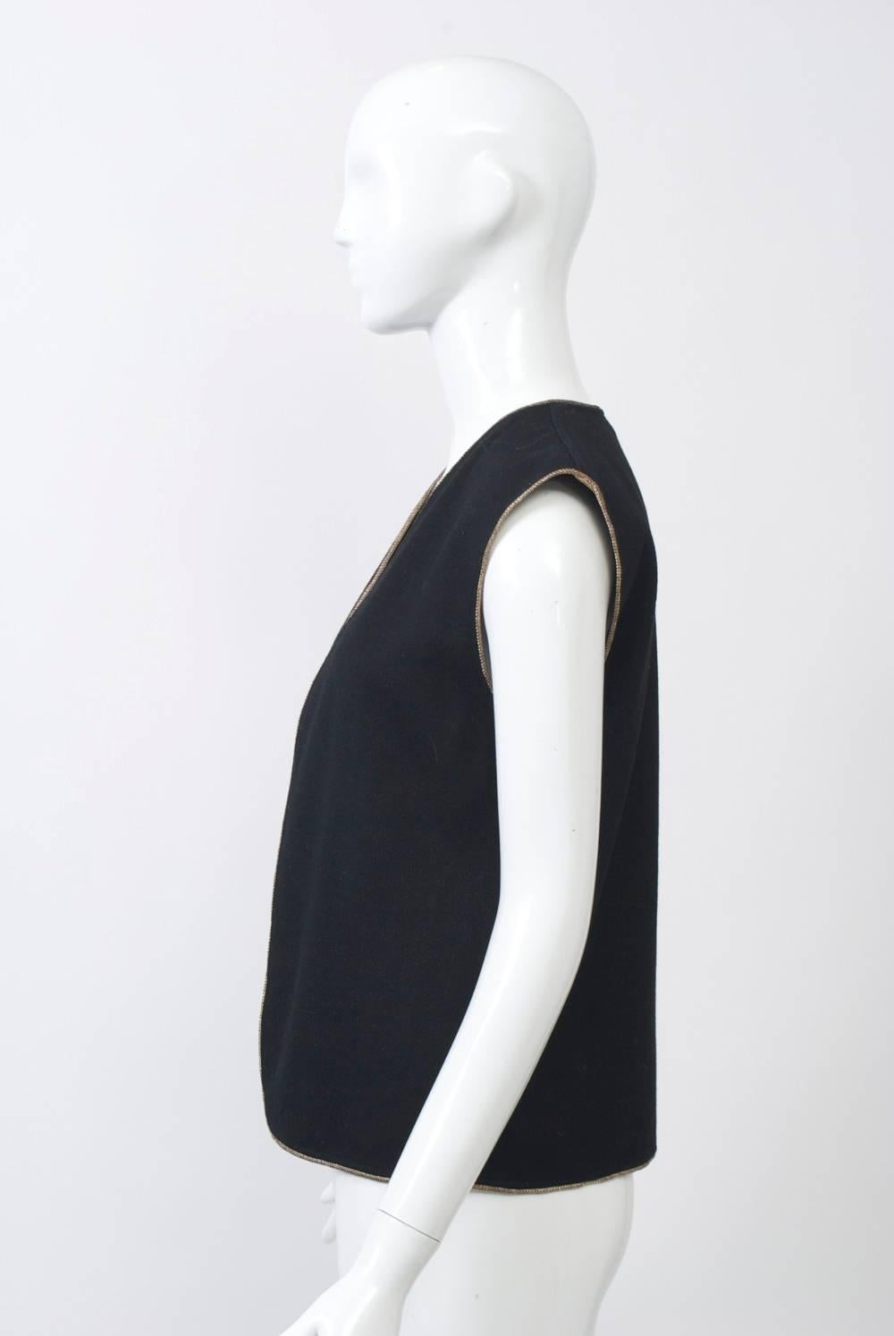 Vintage YSL Russian Collection vest in black wool with gold braid edging all around. Collarless, open front, slightly extended shoulders. Great piece!