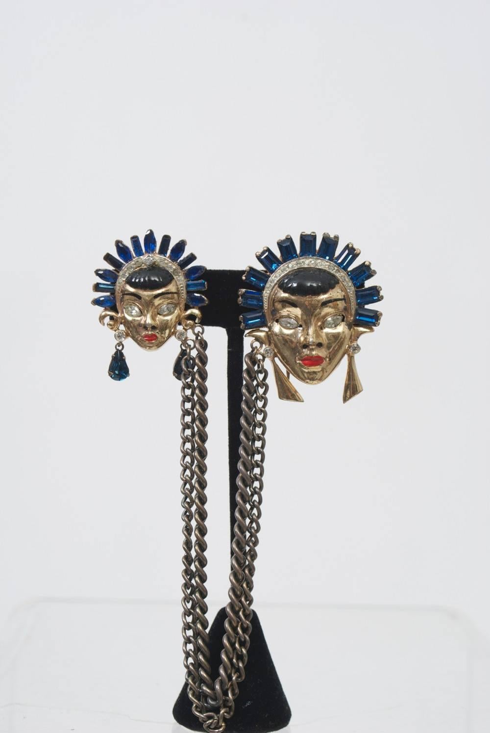 Corocraft sought-after double-face clip with chatelaine, one large and one small, each with gold vermeil, enameled features, rhinestone eyes, and sapphire crowns. Dangling earrings complement the look - gold triangles with rhinestones on the large