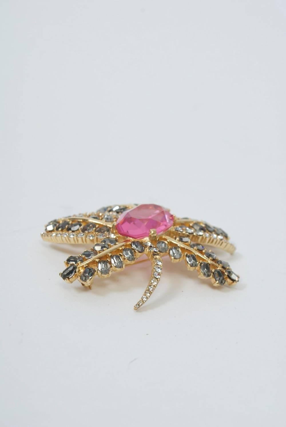 Floral shaped brooch with gray and crystal rhinestone 