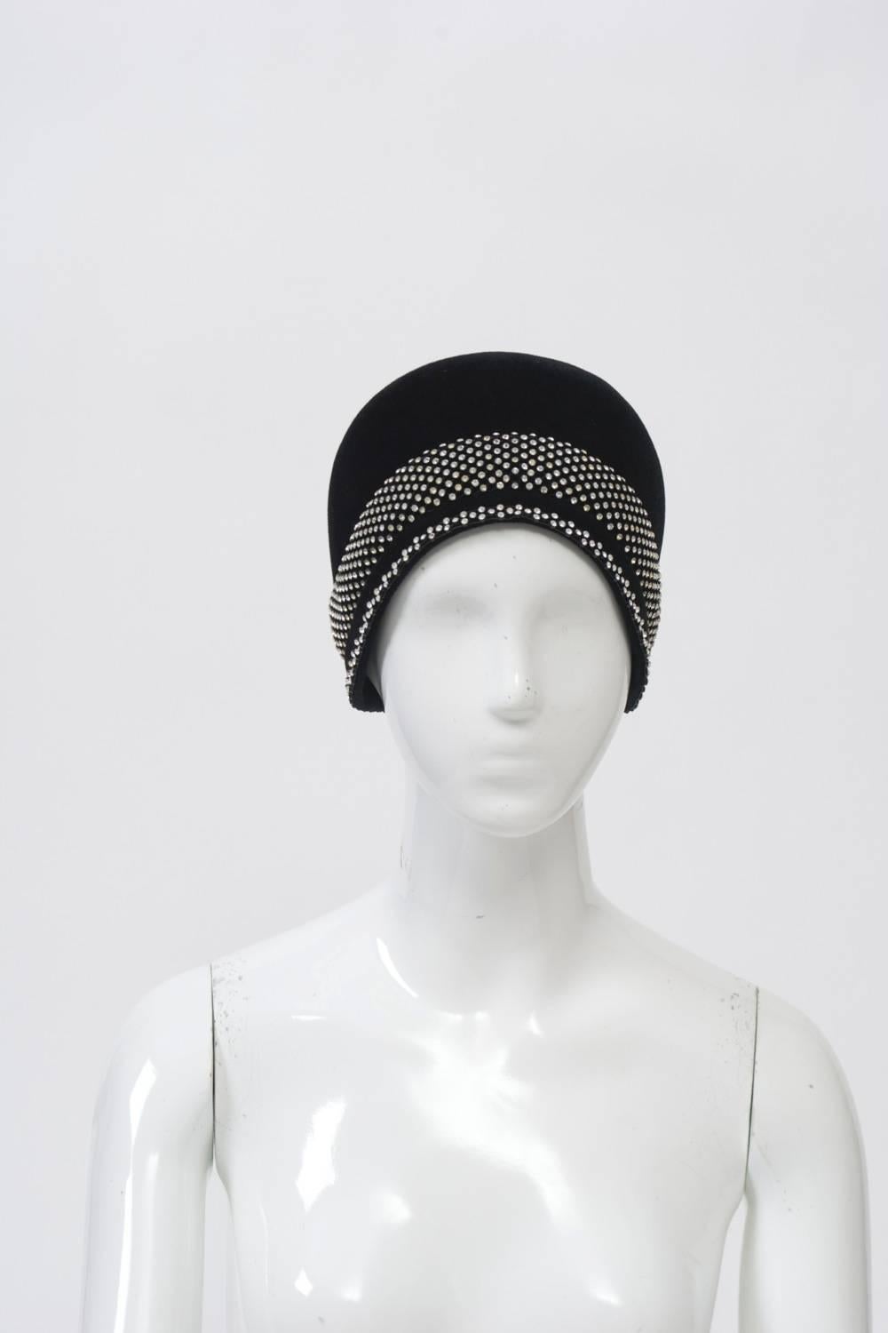 Cloche hat in luxe black felt with wide band of rhinestones around crown and narrow row around rim. Nicely shaped. Unlined and unlabeled. Approximate size S-M.