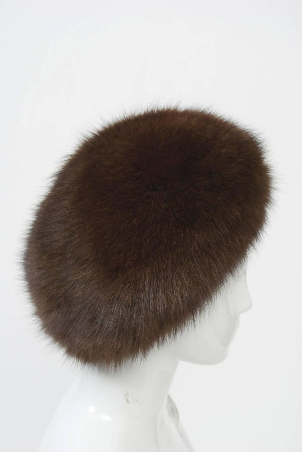 Beret-style hat in dark brown fox with black satin lining. Looks unused - fur lush and fluffy.